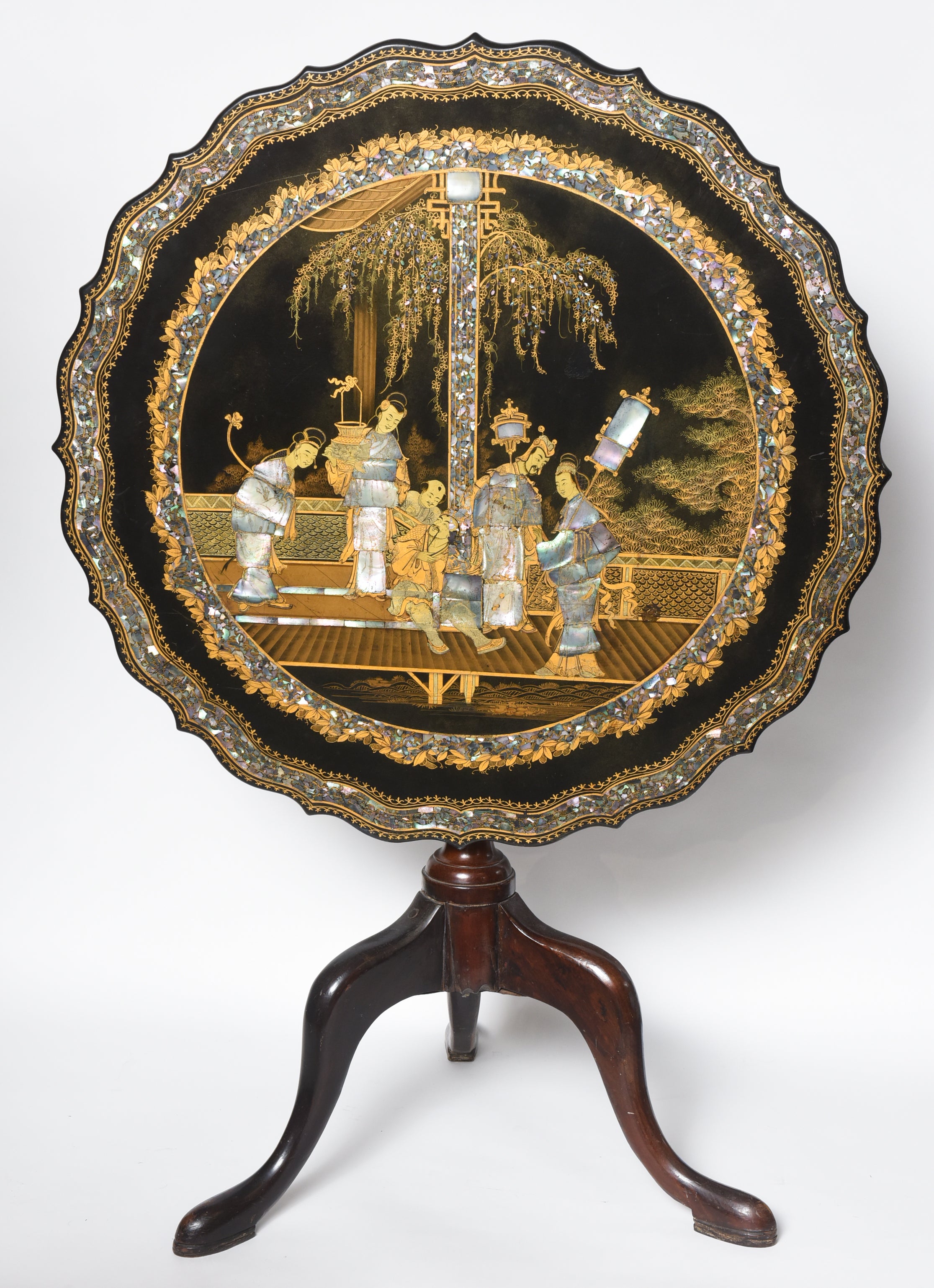 The papier mâché top features fantastic pen work as well as fine shell inlay.
The wooden base is appropriately dovetailed.