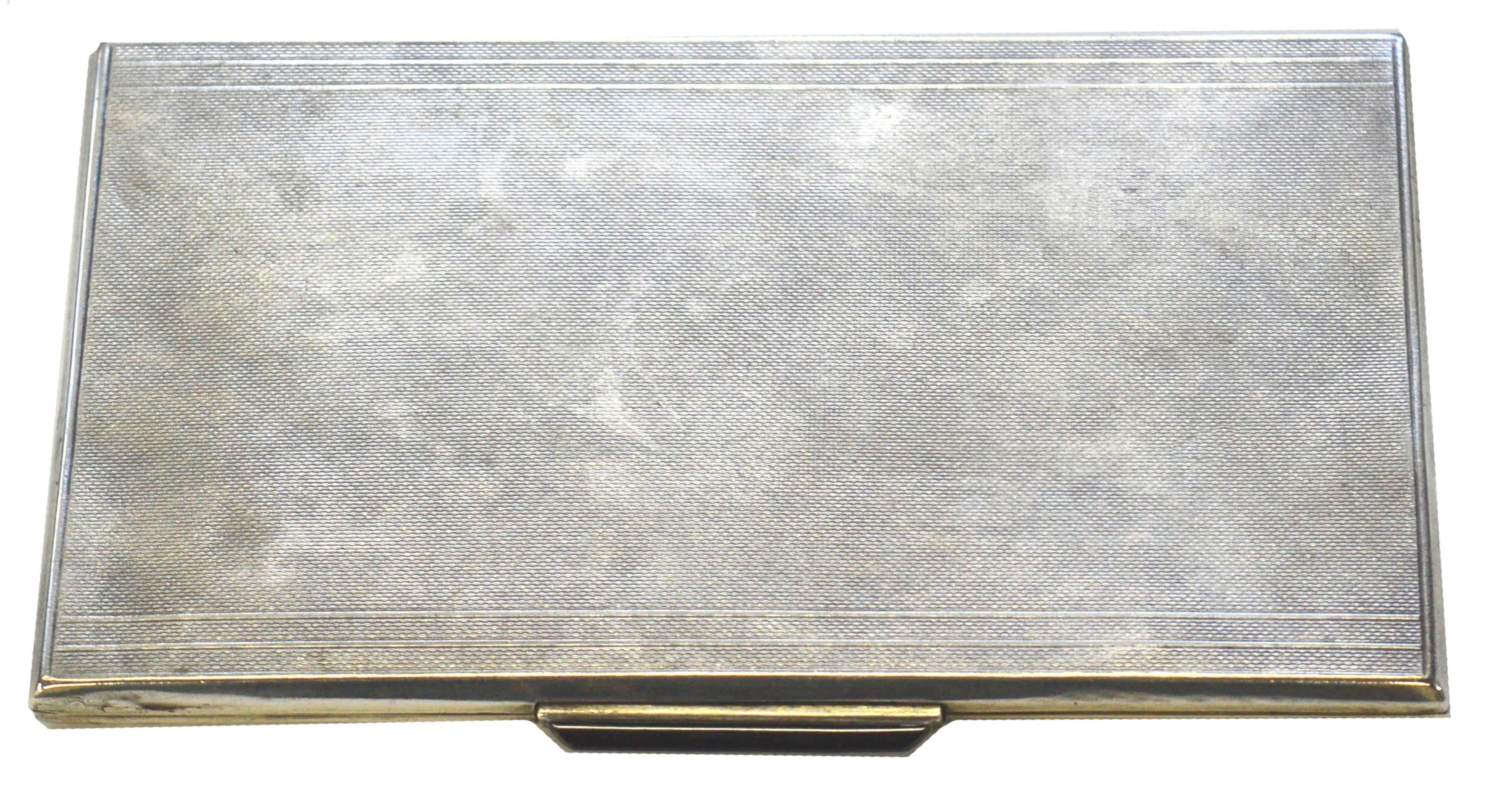 Elegant, beautifully crafted Art Deco Sterling Silver and black onyx cigarette case by Ernst Gideon Bek (German, 1879-1941), circa 1925. Finely textured engraved line surface helps with fingerprints. This could be used as a tres chic credit card or