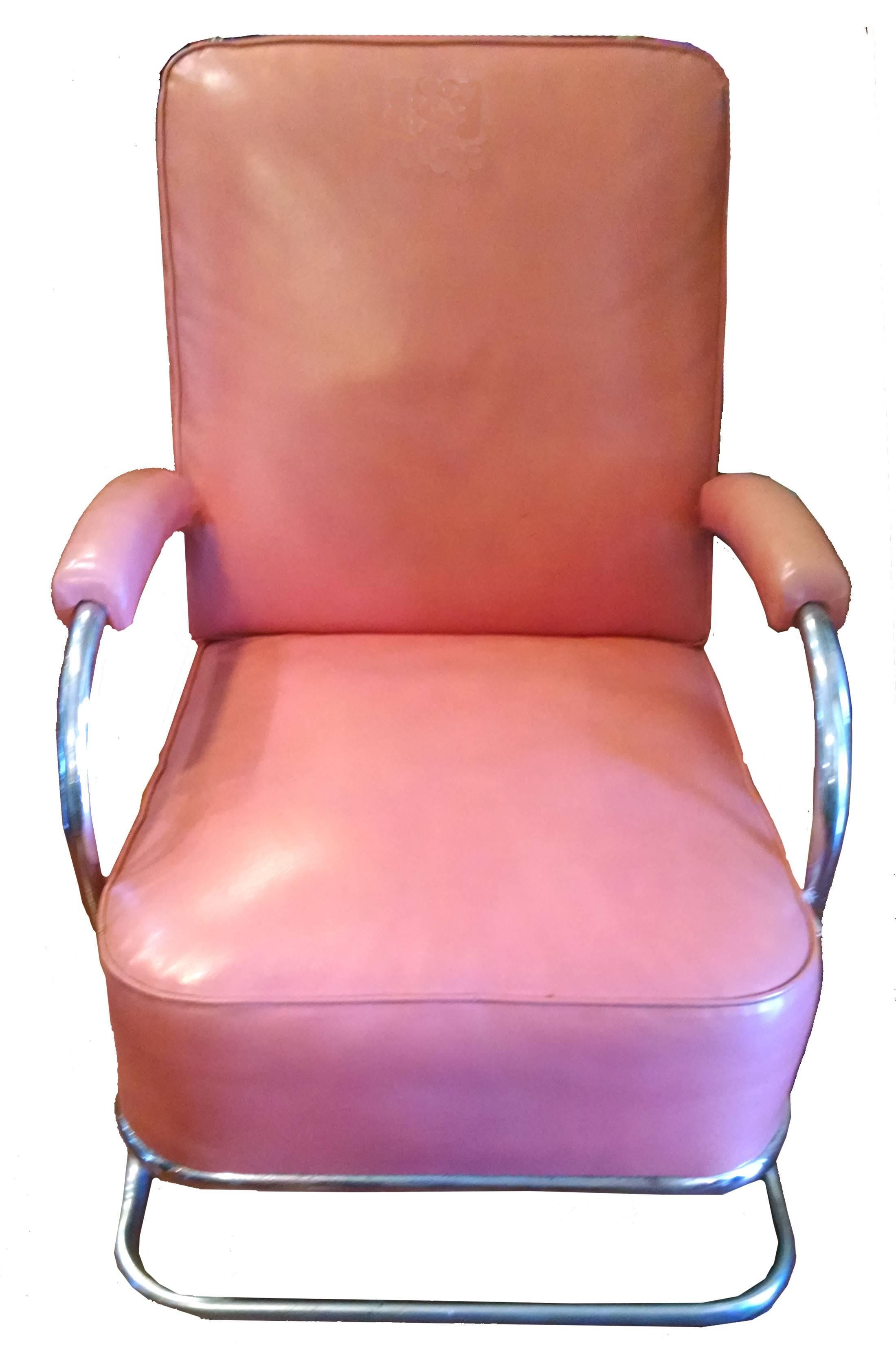 Iconic Wolfgang Hoffmann Art Deco streamlined design for Howell lounge chair, circa 1936. Tubular chrome frame and lovely soft peach faux leather upholstery with matching arms. Some normal wear/pitting to original chrome, not re-chromed. Measures