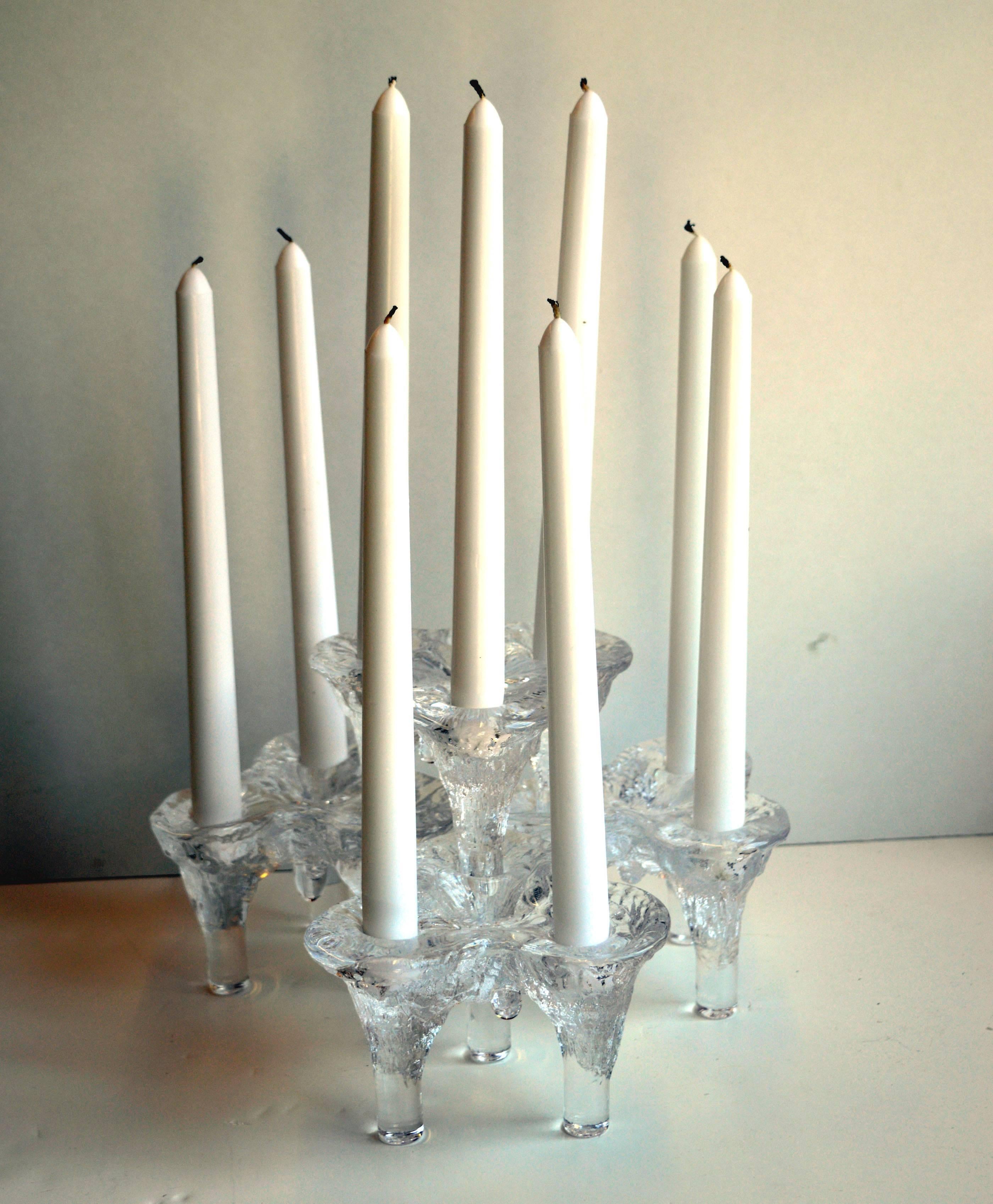 Set of four Mid-Century Modern candle holders by Don Shepherd (American, 1930-1988) for Blenko Glass, circa 1970. Set can be configured in many ways including for Hanukkah and stacked. Would look stunning with primary colored candle or for Holidays