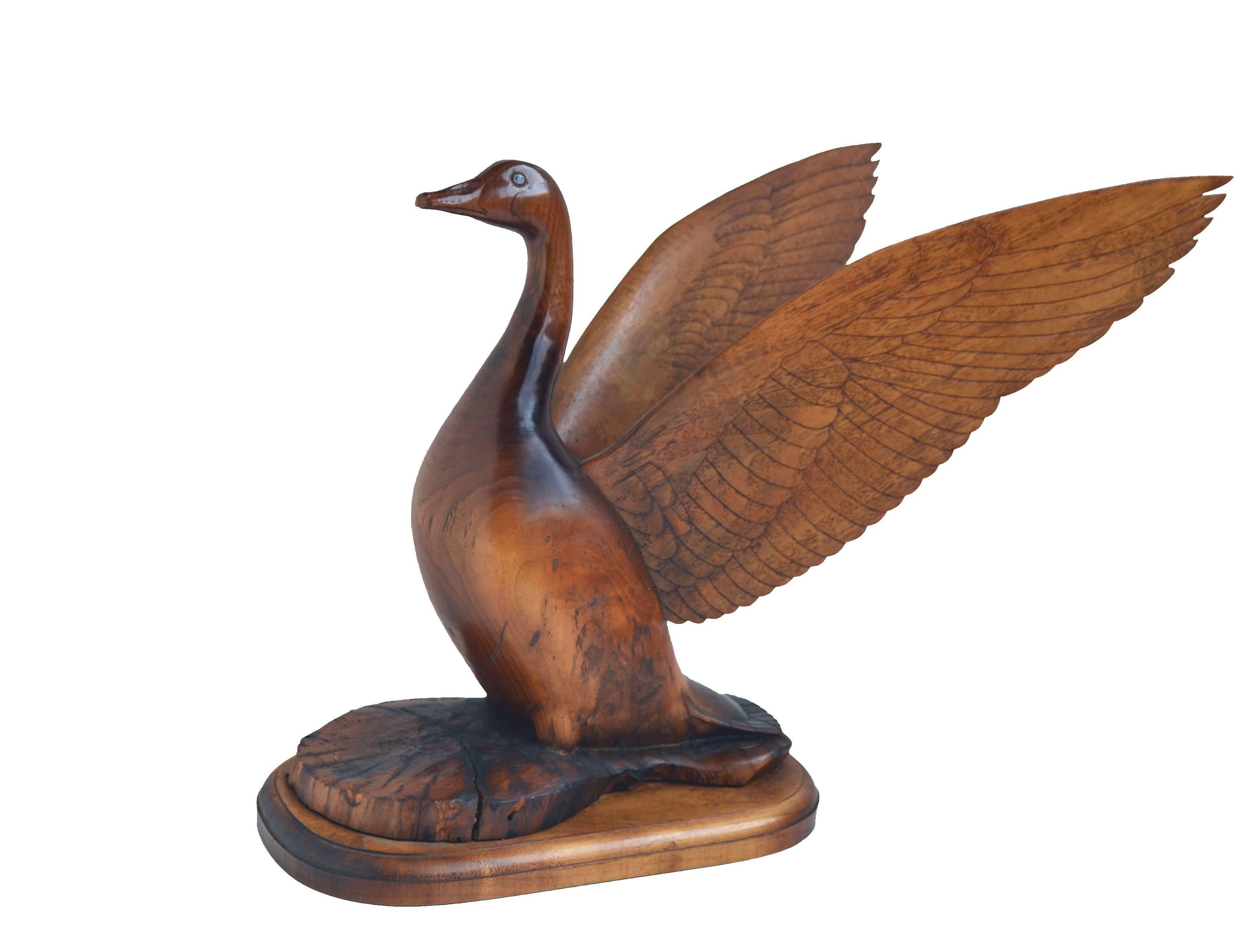 A beautiful, high polished sculpture of a goose with outstretched wings by Dale Eugene Schoth (American, 1925-1984). Appropriate to view in the round. Signed and dated by the artist 