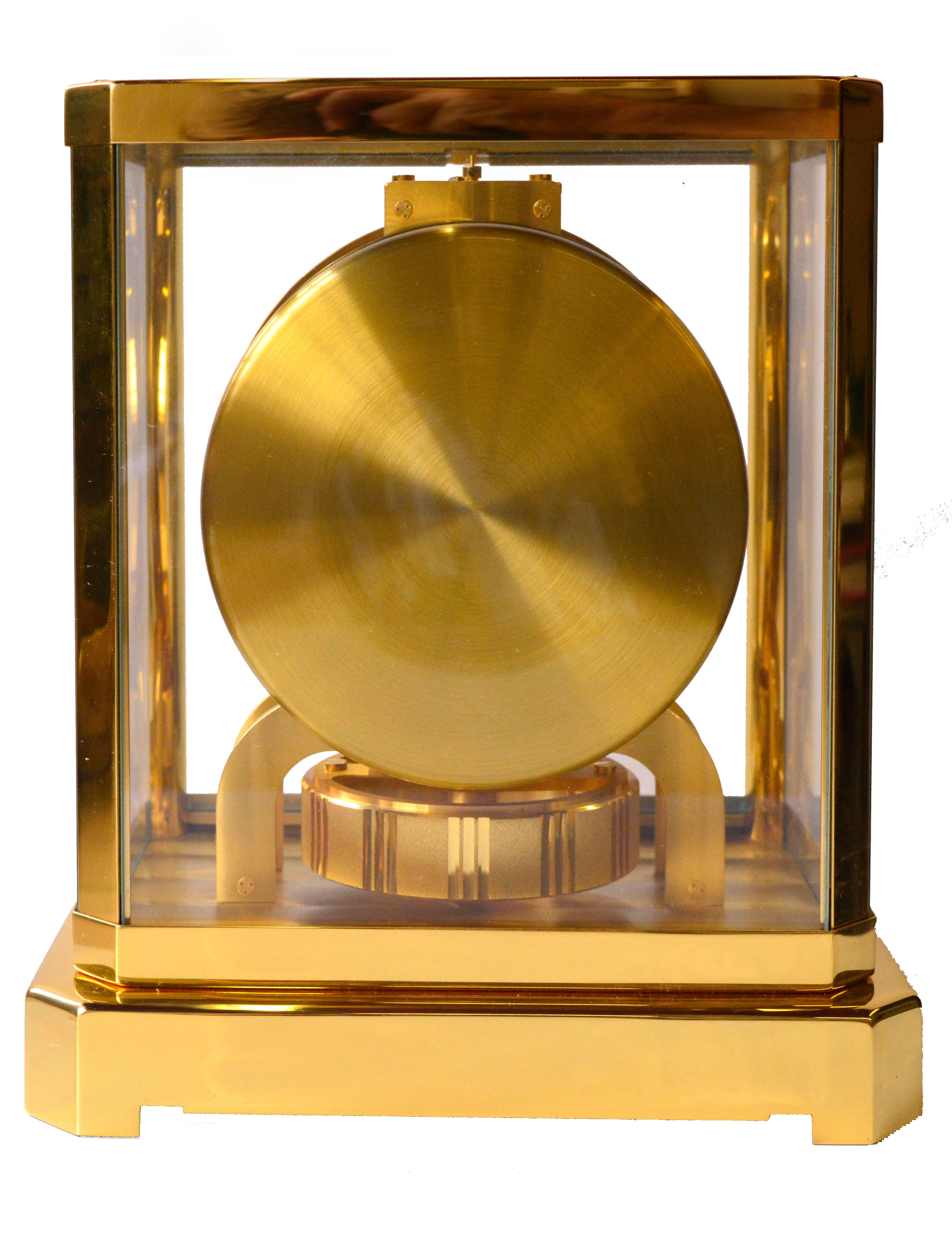 Jaeger-LeCoultre Atmos perpetual motion gold-plated 15 jewel clock. Model number 528-8, circa 1983. The clock is in perfect working order, white dial is in excellent condition, has Arabic gold-plated over brass numerals going around the clock face.