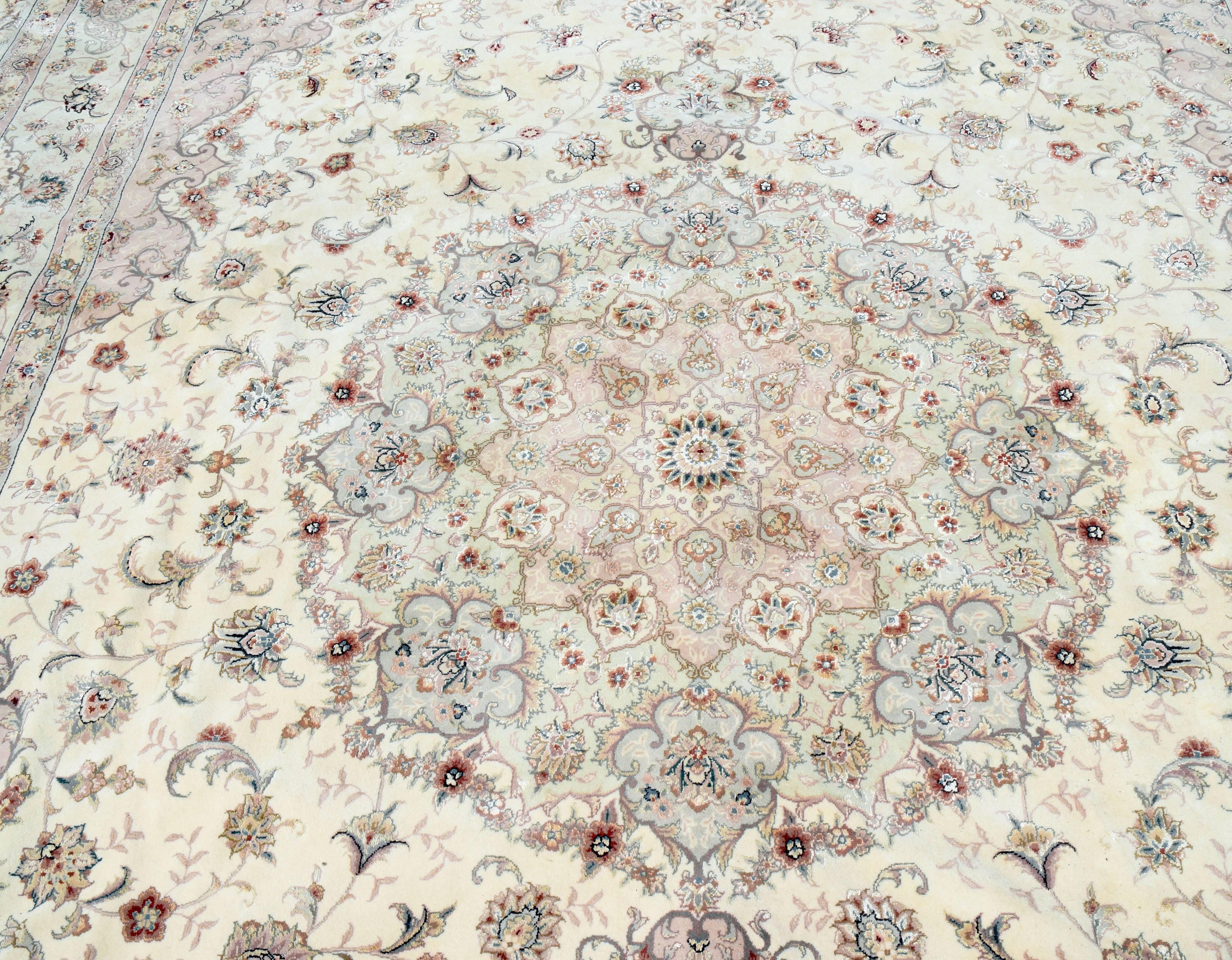 Beautiful wool rug with silk highlights by expert weavers from the Turkey/Pakistan/Turkmenistan region, circa 2000. High knot content and superior wool quality makes this is a very special rug. Pastel shades in champagne background and rose with