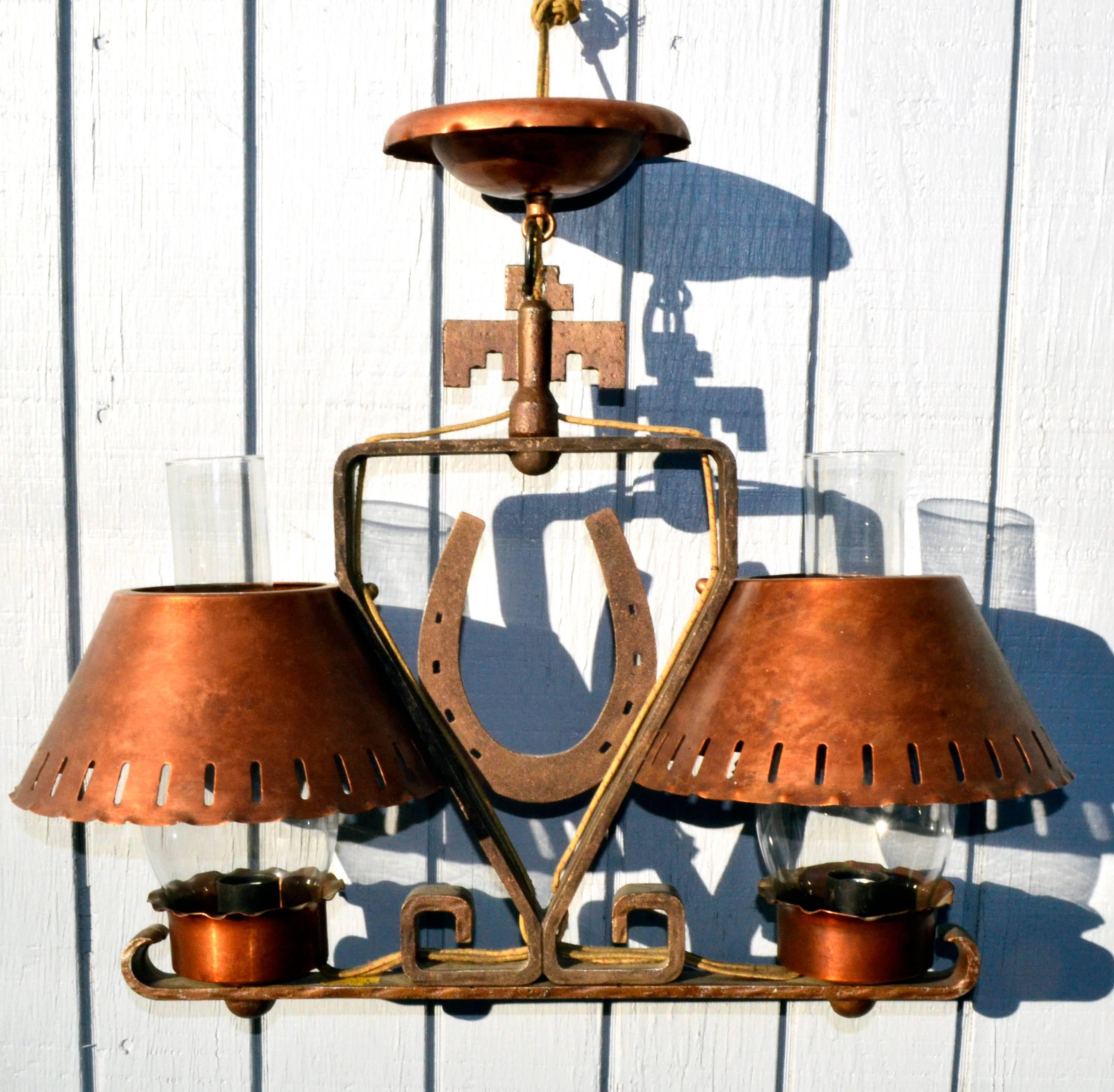 Wonderful rustic Horseshoe Ranch lamps made of copper shades and iron framework, circa 1940s. Size; 17