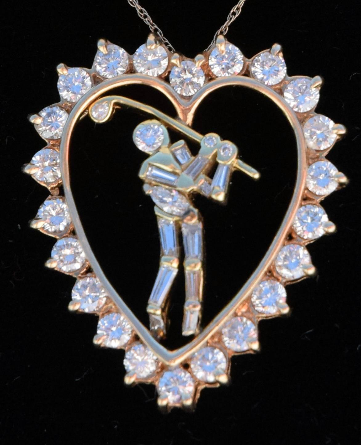 A Jose Hess jewelry designer masterpiece, circa 1990 era diamond pendant in the signature Golfer and Heart design. The heart has 22- round brilliant diamonds for Approximately 1.86 Carats, VS2 Clarity, G-H color and the Golfer has 11 Baguette