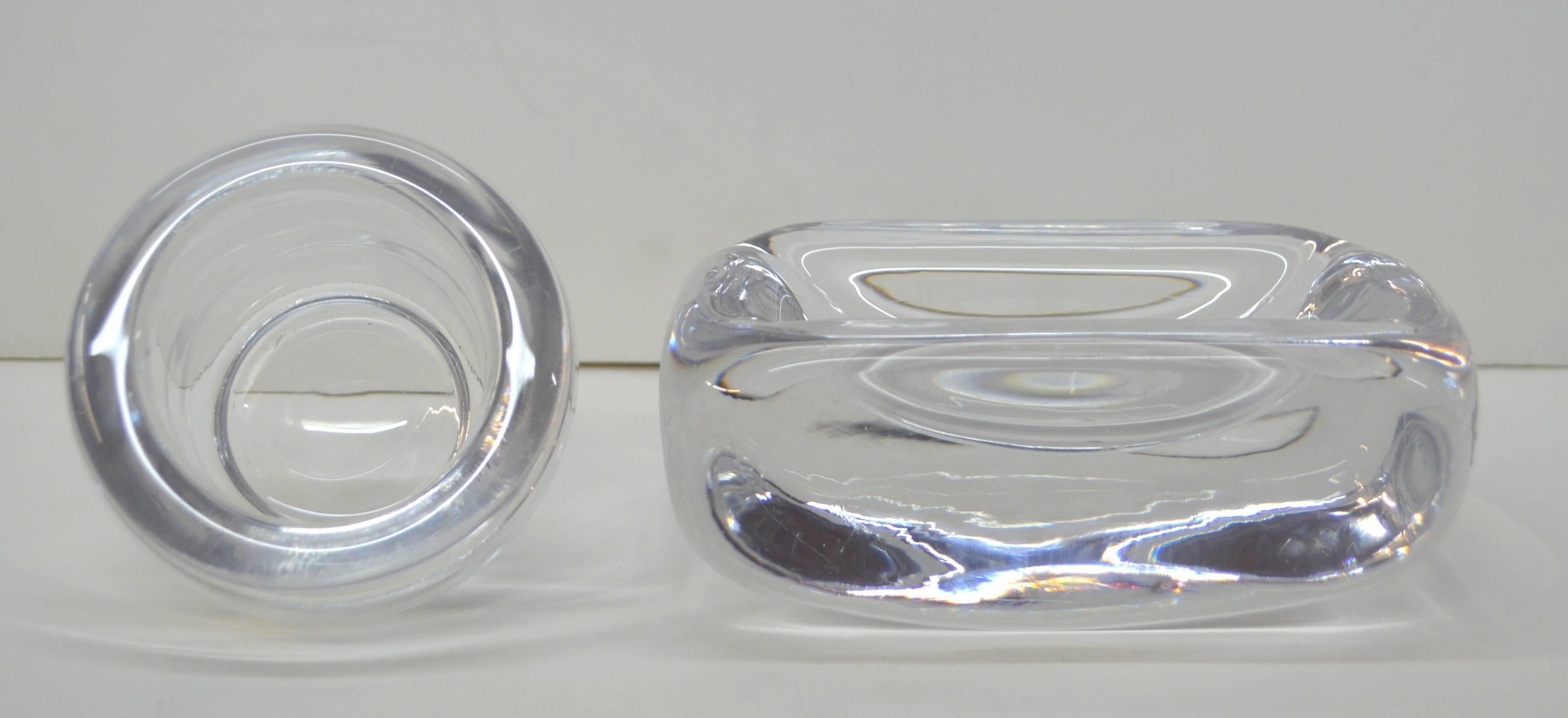 Wonderful pair of Orrefors midcentury clear glass cache tray/candy bowl/ashtray and votice/cup designed by Vicke Lindstrand (Swedish, 1904-1983), 1957. Each piece engraved 