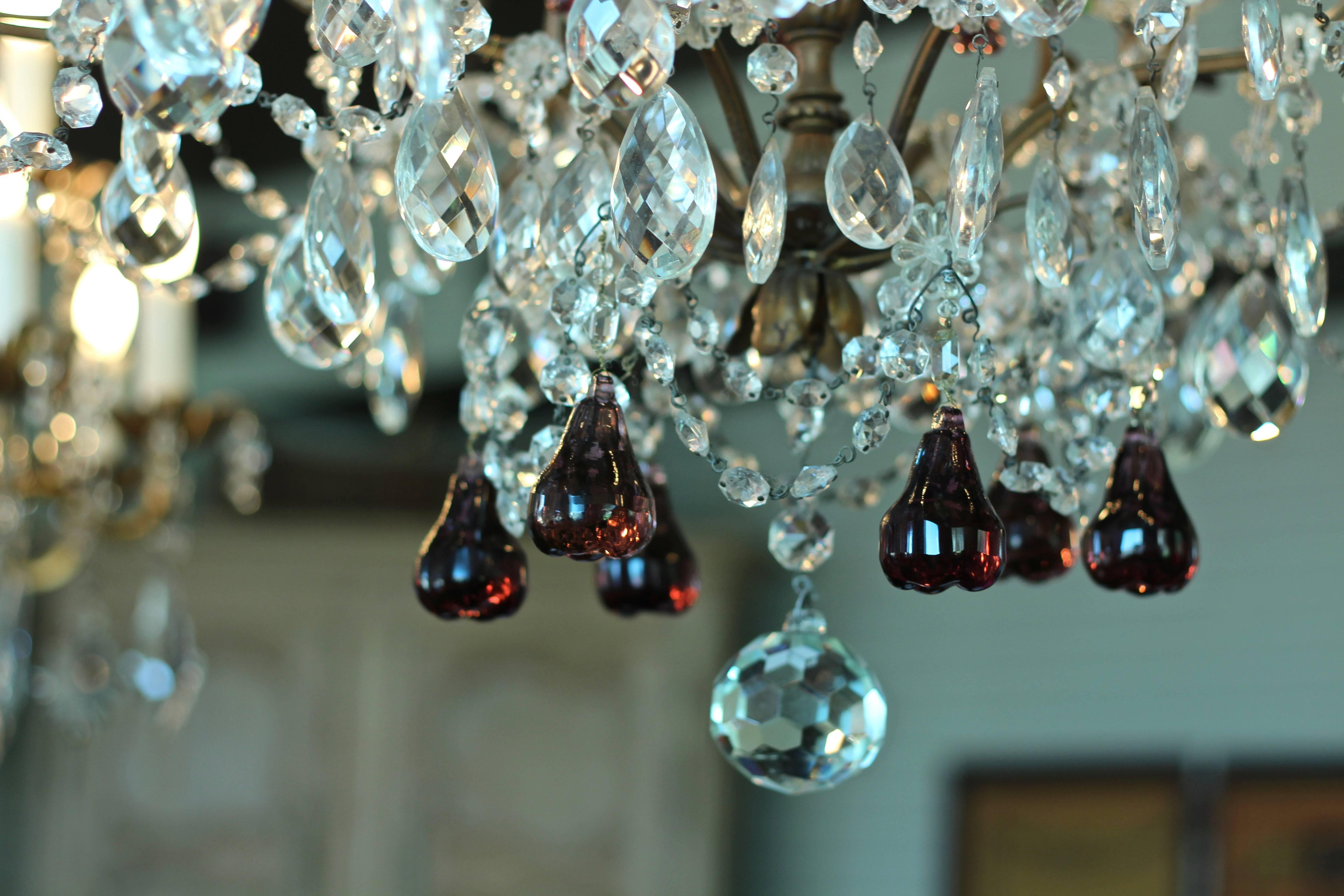 Beautiful six light crystal chandelier with accents of purple and green crystal pears and grapes. 