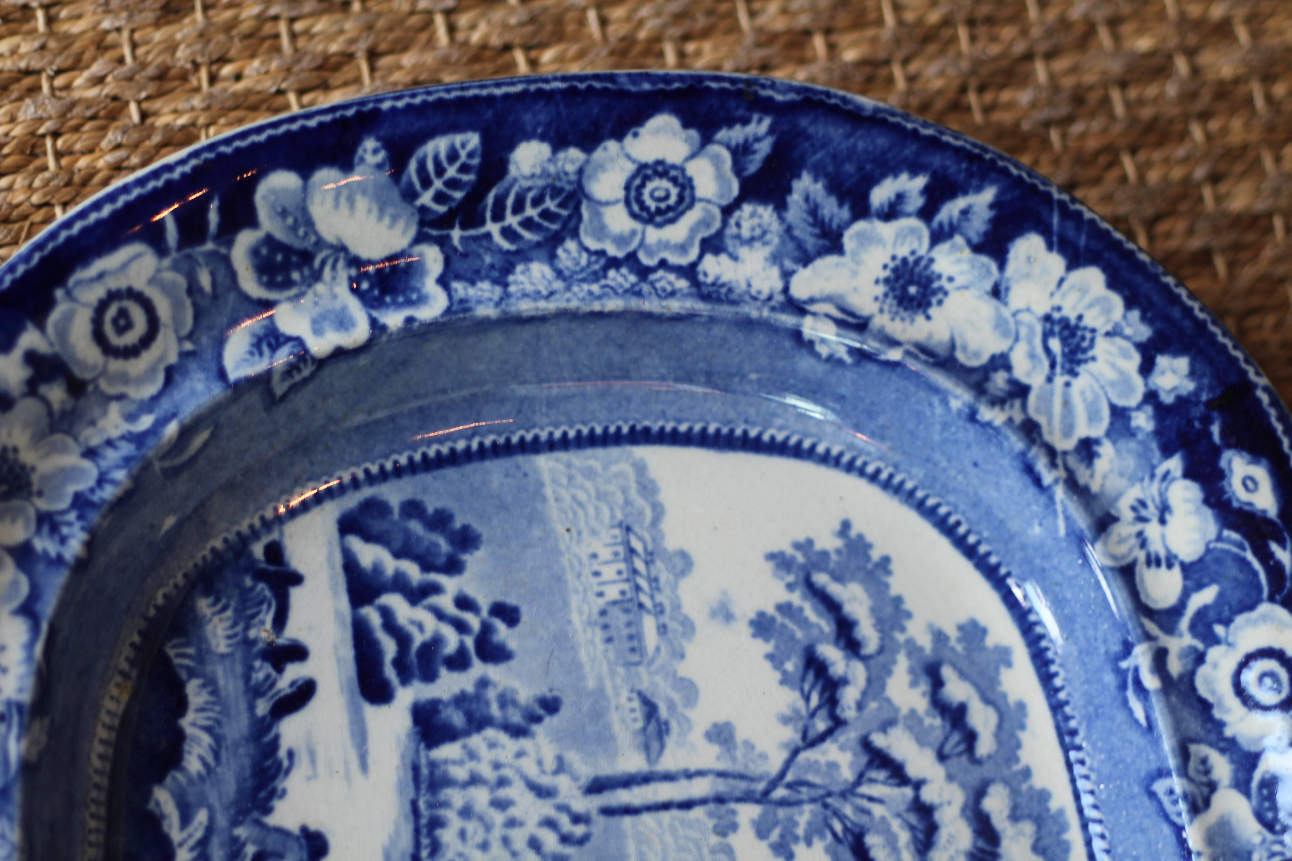 Beautiful 19th century blue and white transferware platter with river scene.