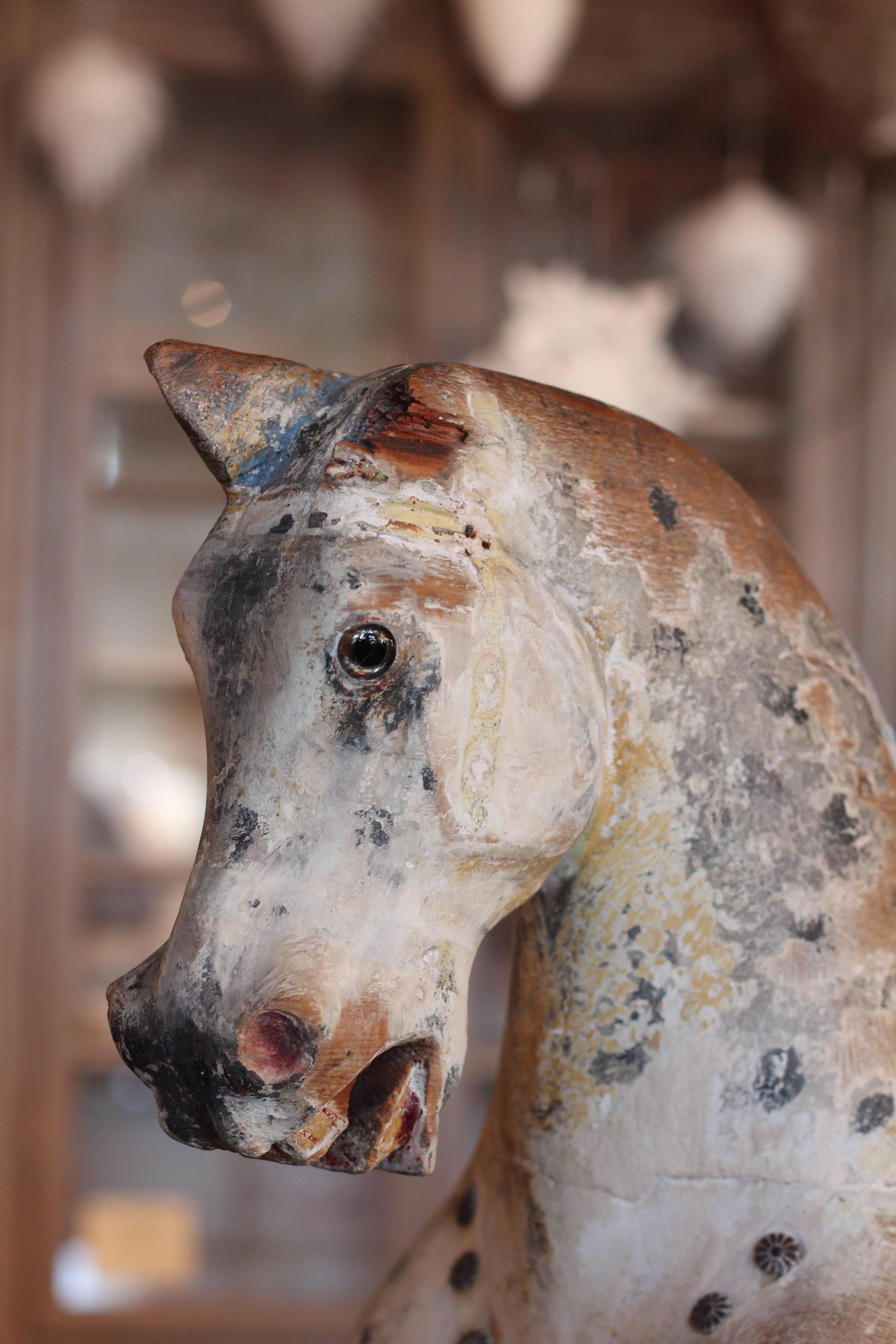19th century carved horse with glass eyes. Impressive scale. Original paint.