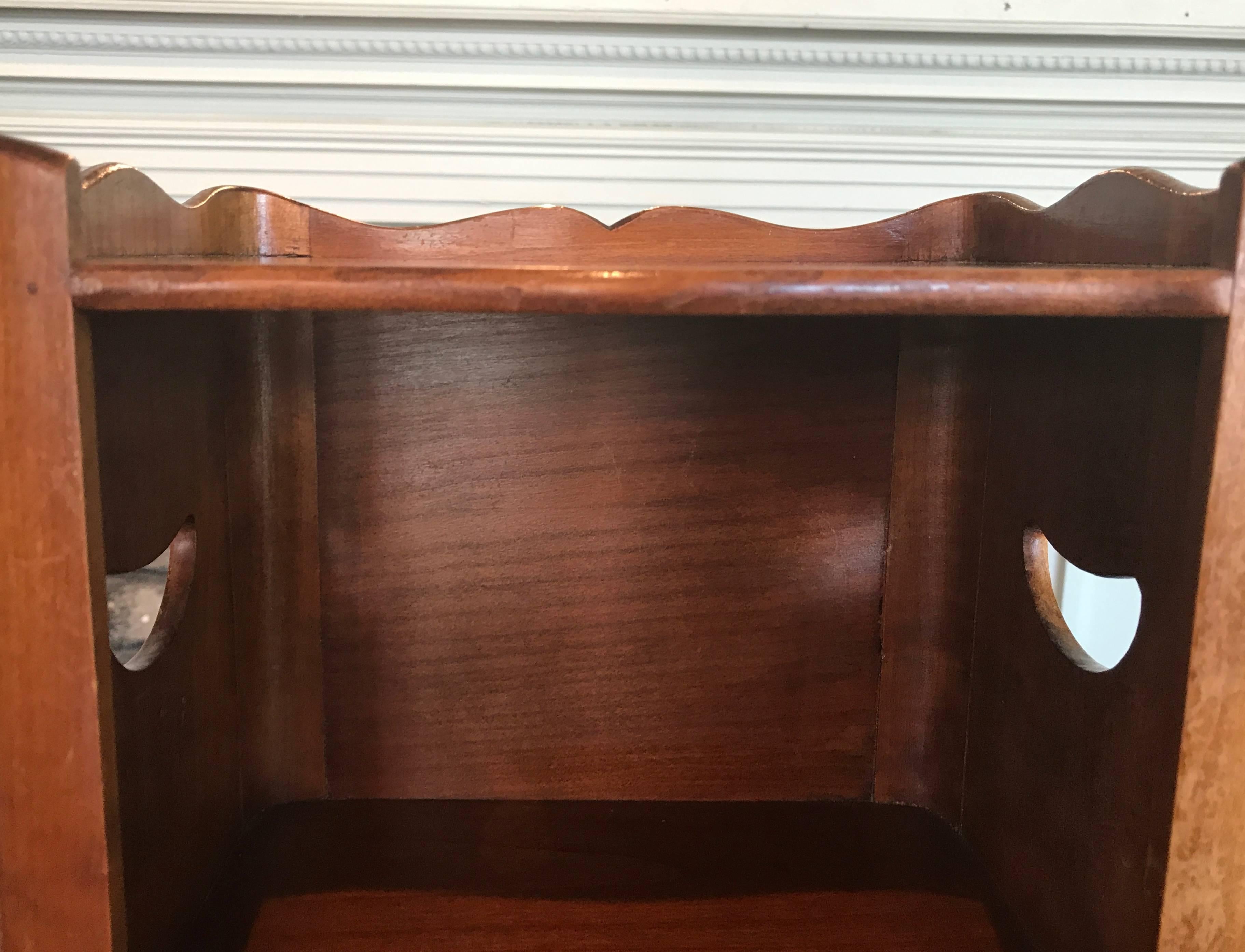 Mid-20th century French mahogany side table with shelf and drawer.