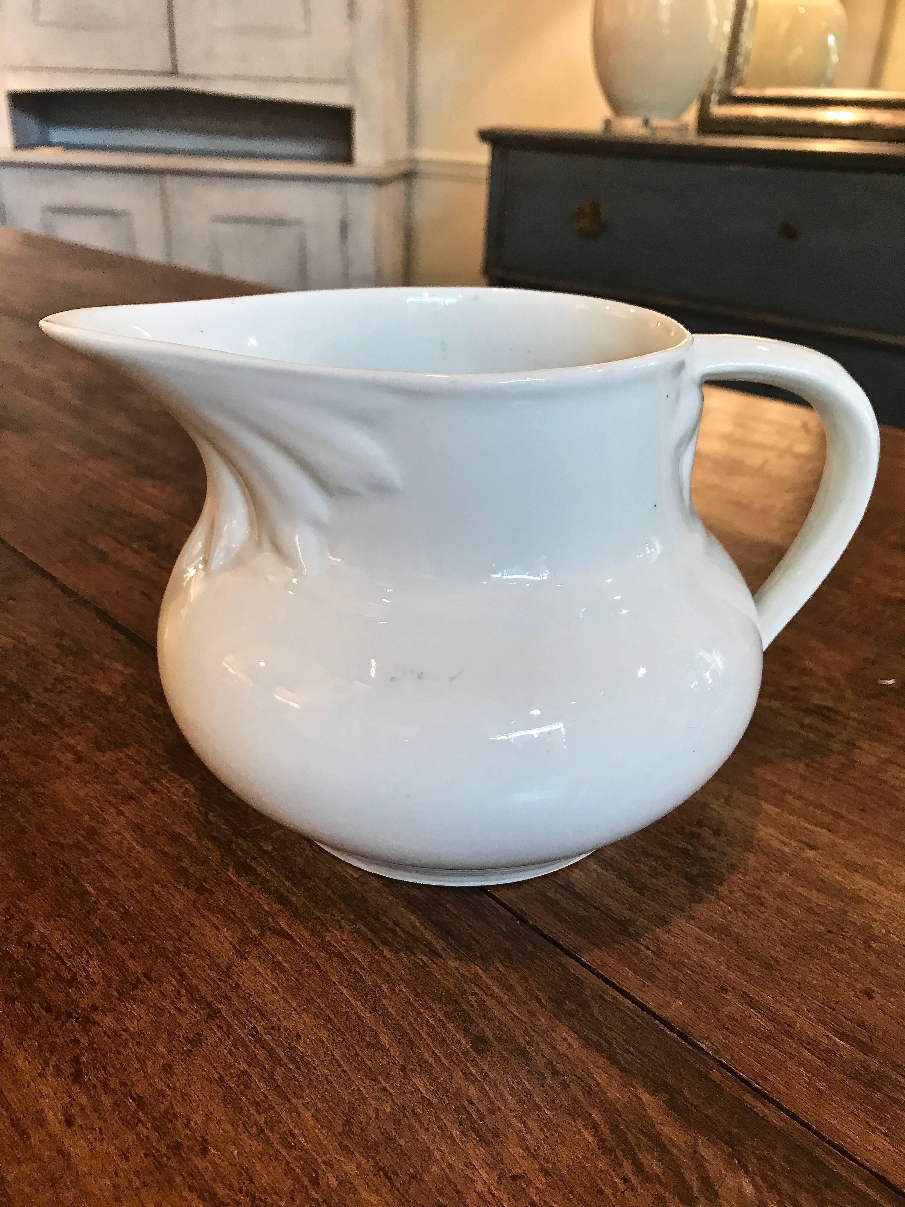 Early 20th century English ironstone jug with floral detail.