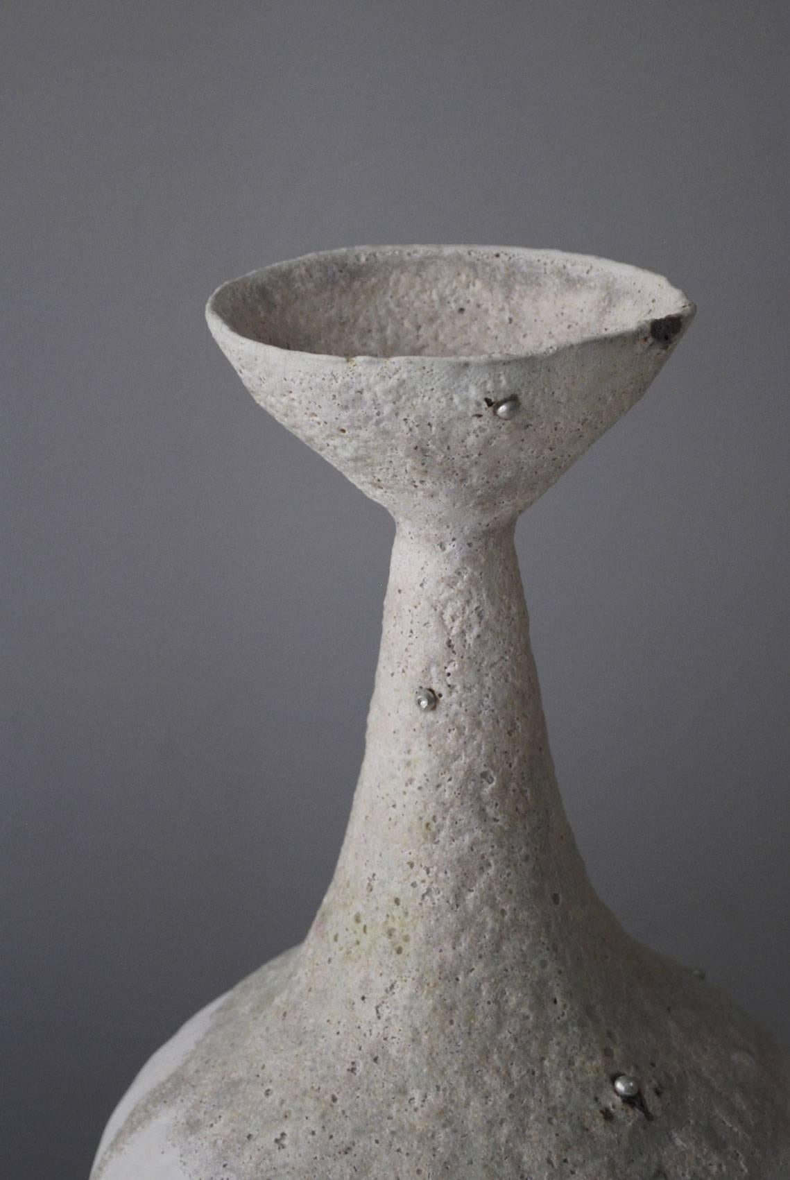 Unique vase by Alana Wilson
Purity / 3017 (Ritual)
Terracotta with porcelain slip, stoneware glazes, fusible metall alloy
Measures: 39 x 20 x 20cm

 Alana Wilson's work explores both primitive and contemporary aesthetics and techniques in order