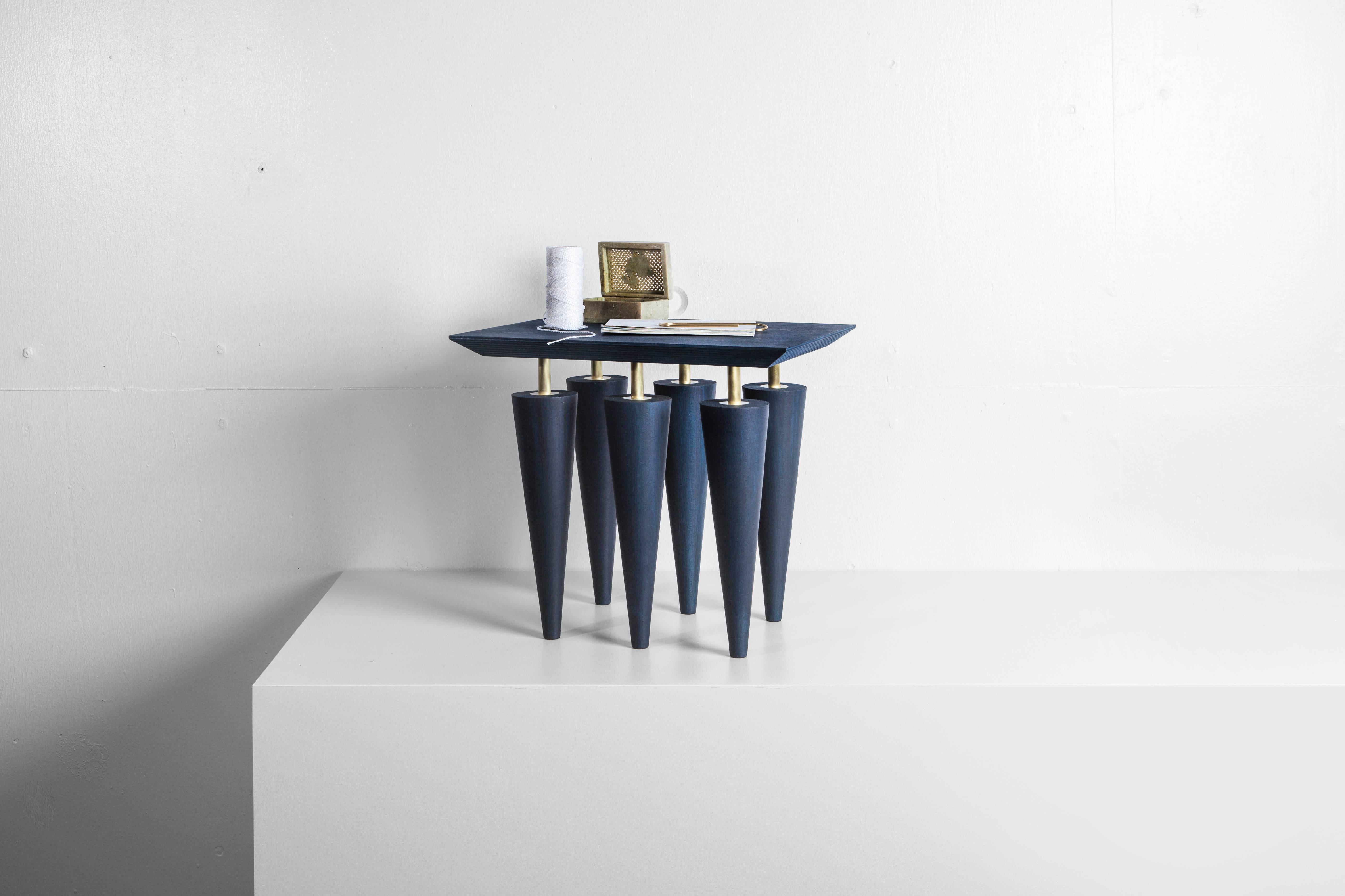 Blue birchwood and brass coffee table, Zwei design
Top: Multiplex birch plywood with birchwood veneer
Legs: Solid birchwood
Detailing: Hand brushed brass
Dimensions: 366 mm x 410 mm x 330 mm

Talitha and Michael Bainbridge are a German and