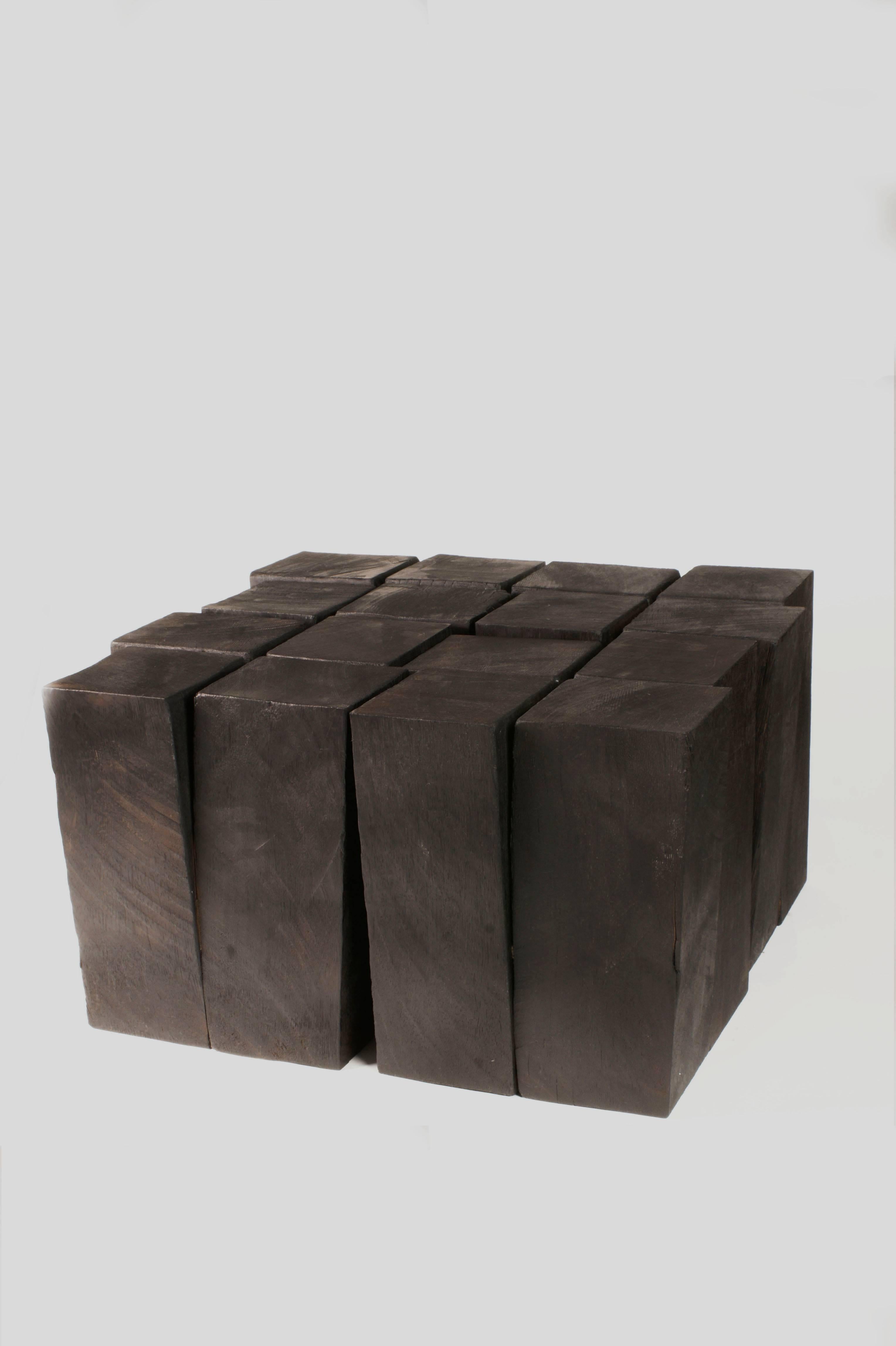 Four legs series
Coffee table in Iroko wood 
Four cubes 35 cm H x 64 cm W x 64 cm D - 22,5” H x 14.5” W x 8.3” D
Six cubes 35 cm H x 96 cm W x 64 cm D - 22,5” H x 14.5” W x 8.3” D
Signed by Arno Declercq

Arno Declercq
Belgian designer and