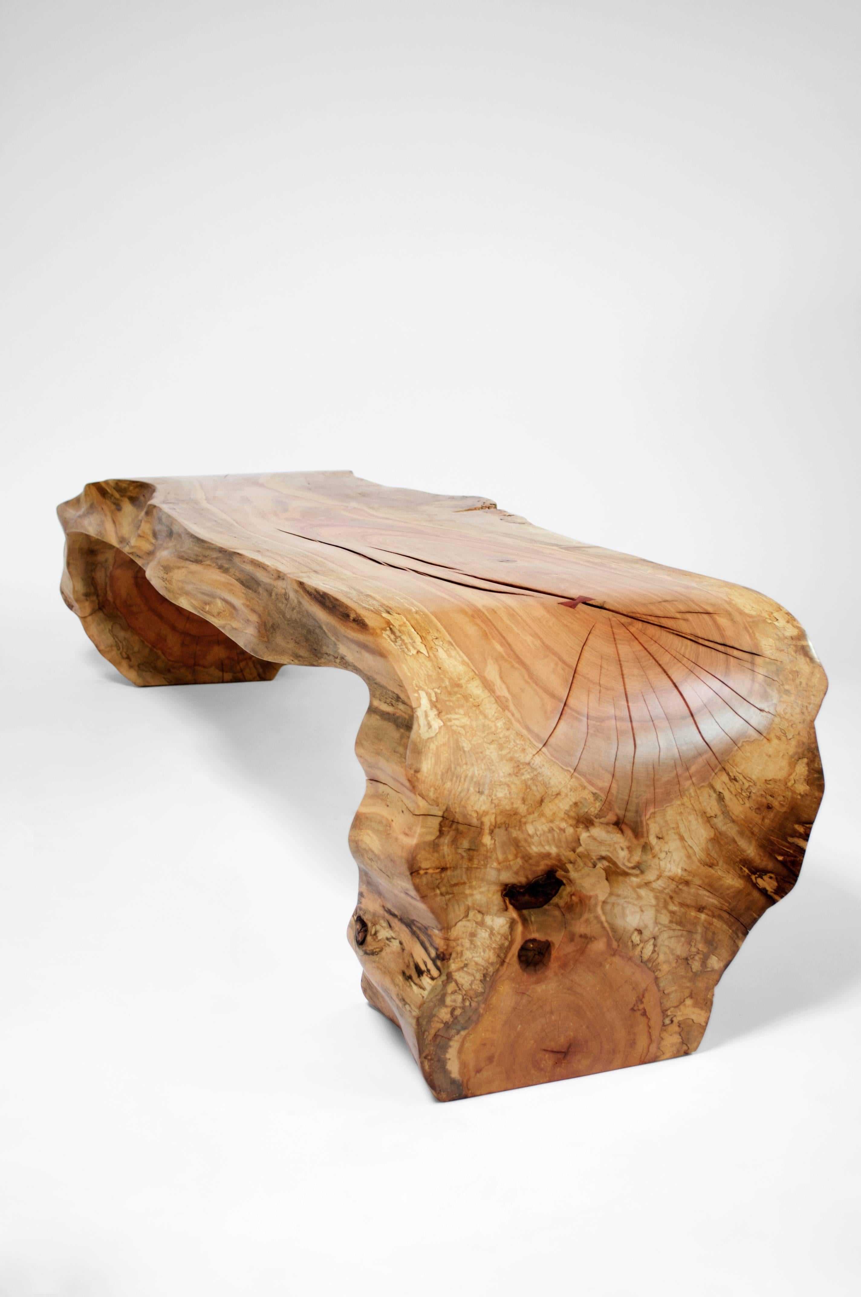 Unique signed bench by Jörg Pietschmann
Bench· Norway Maple·
Measures: H 40 x W 172 x D 55 cm
Carved out from a tree trunk, reddish heartwood. Polished oil finish.

In Pietschmann’s sculptures, trees that for centuries were part of a landscape