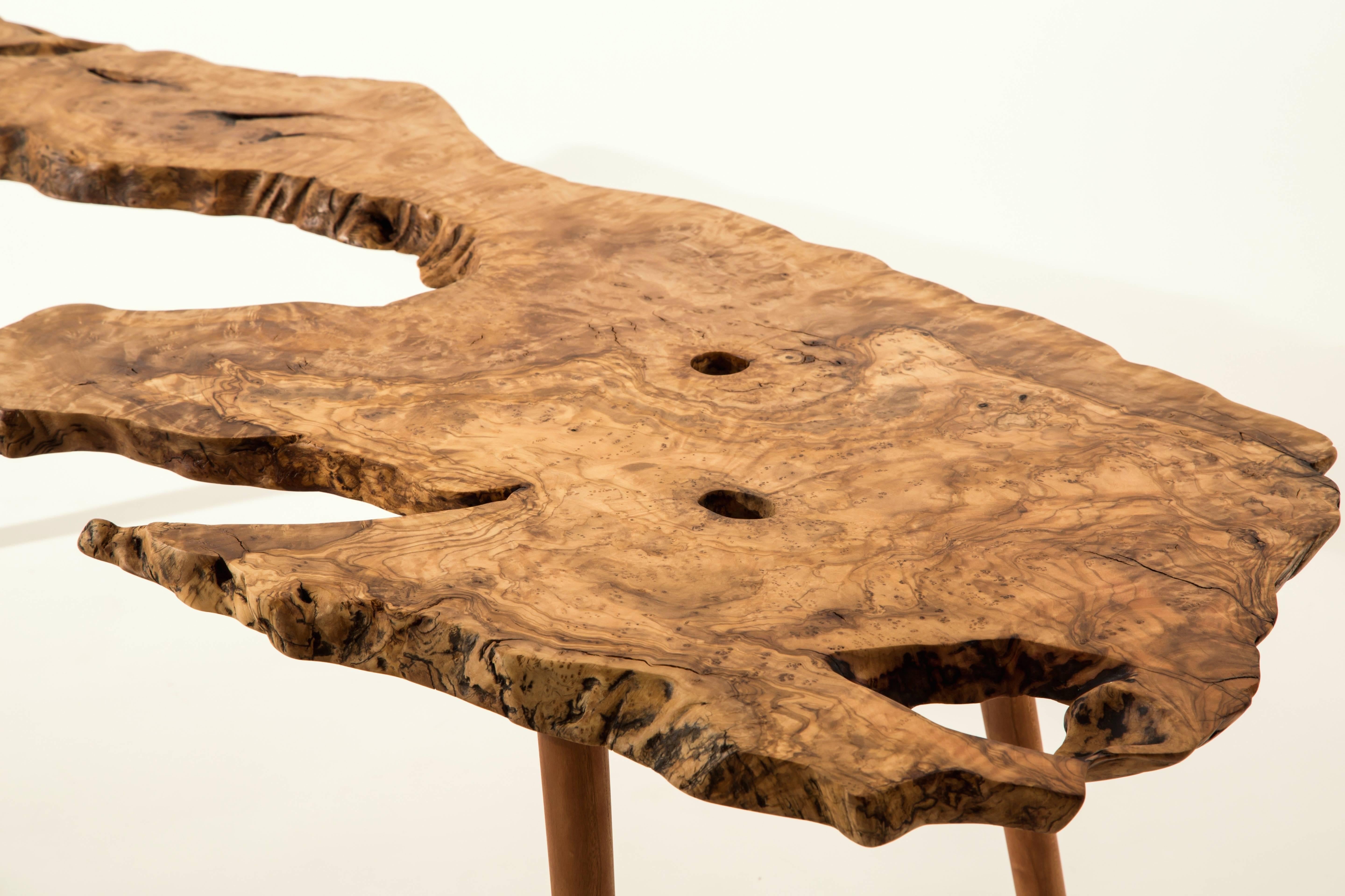 Unique Signed Table by Jörg Pietschmann
Side table olive, American black cherry. Measures: H 37 x W 130 x D 40 cm.
Vivid shaped section of an olive tree on feet of American black cherry. Polished oil finish.


In Pietschmann’s sculptures, trees