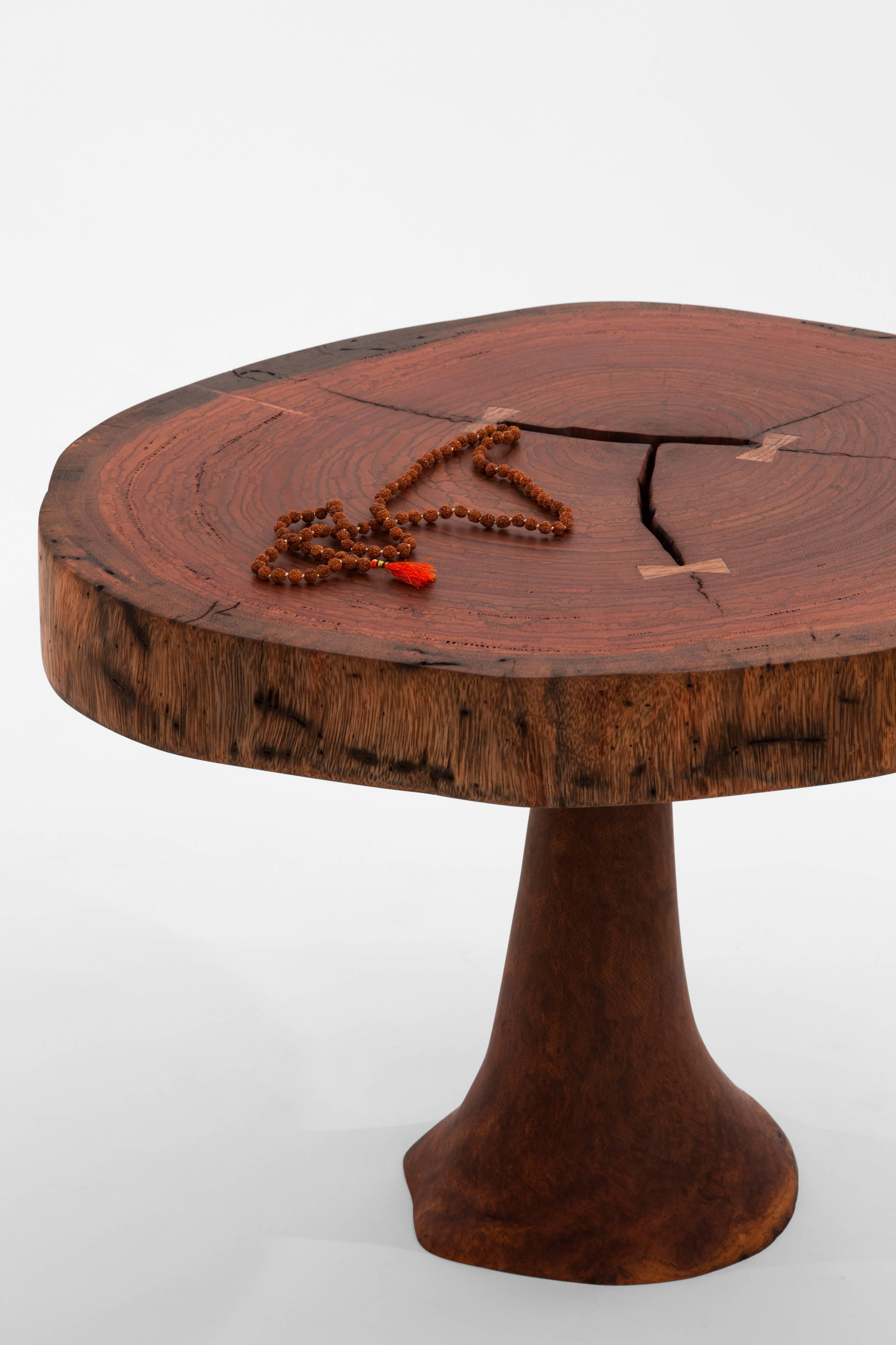 Unique signed table by Jörg Pietschmann
Table · Ebiara / Australian grass tree, T1104
Measures: H 43 x W 58 x D 55 cm tabletop 7 cm
Red coloured wood with three butterfly inlays, fixed on a leg of Australian grass tree.
Polished oil