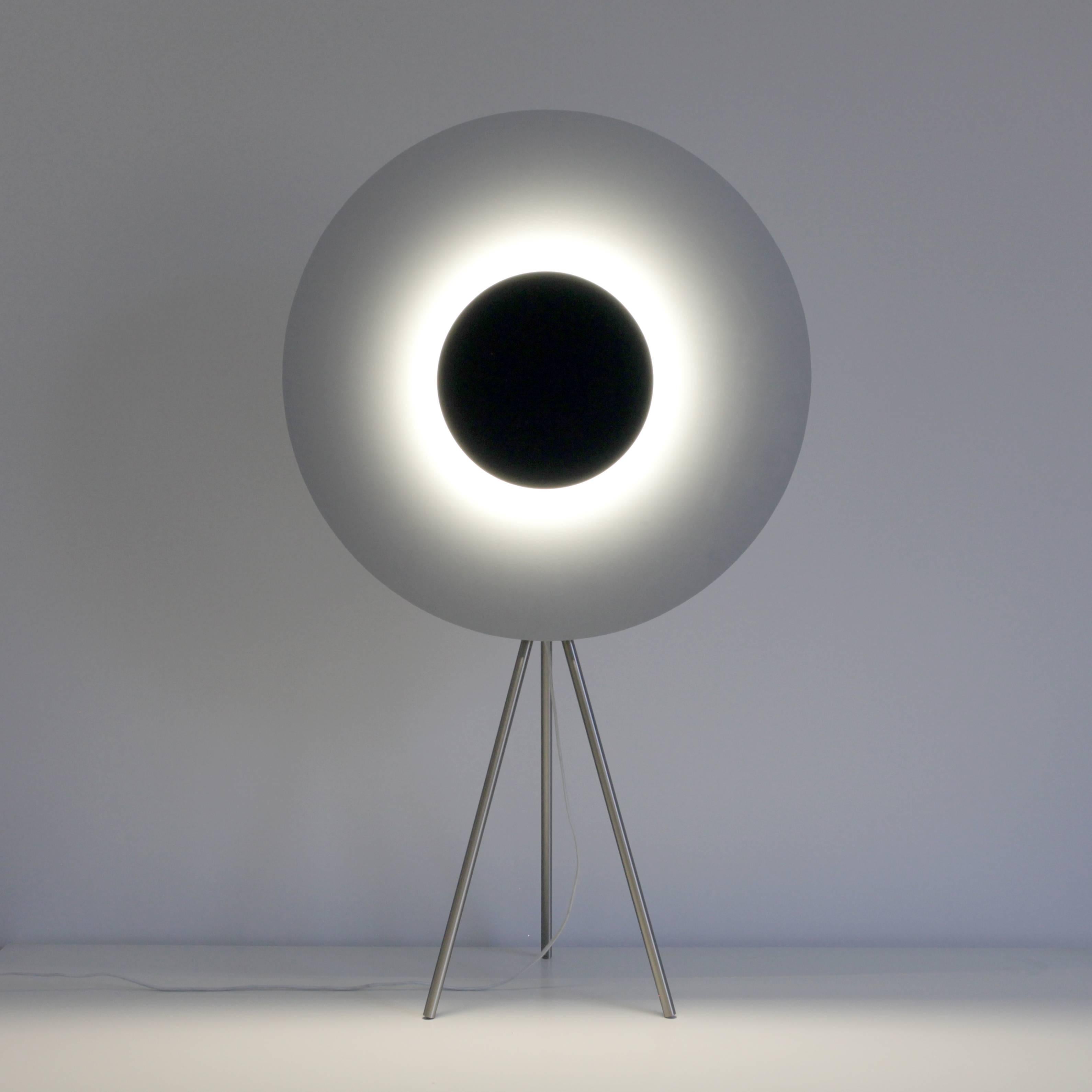 Eclipse Table Lamp by Arturo Erbsman (Handcrafted design artwork by Arturo Erbsman)
Limited edition, signed and numbered
Dimensions: 85 x 49 x 23 cm
Materials: anodized aluminum disc, mirror, LED spotlight, wood, steel base

All our lamps can be