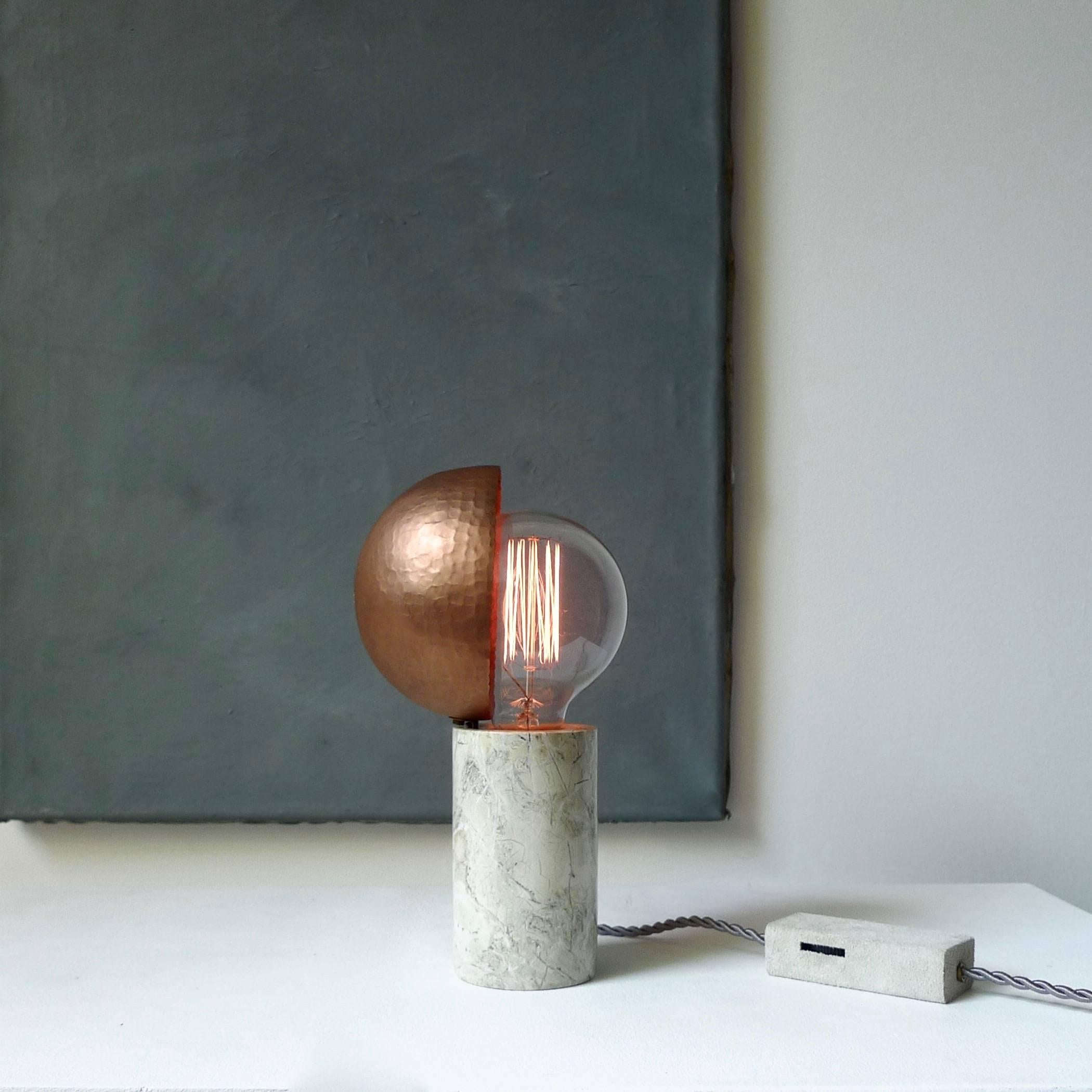 Marble table lamps, Sander Bottinga
Base in different kinds of marble
hand-hammered copper shade movable around light source.
A dimmer inlaid with leather
Dimensions: H 24 x W 12 x D 11 cm
The design artwork is meticulously handcrafted in a limited