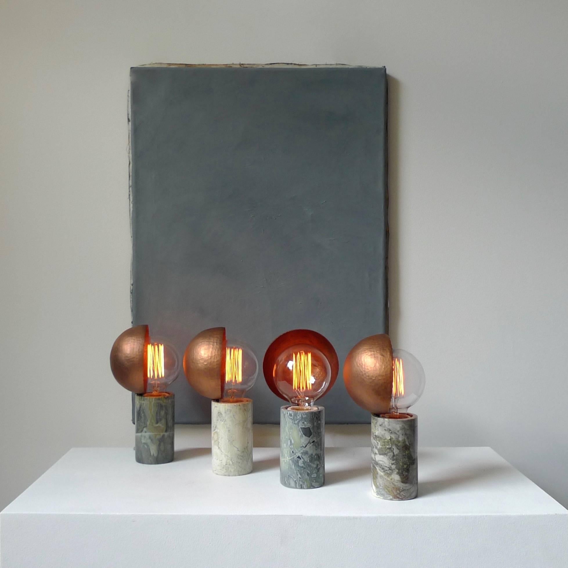 Marble table lamps, Sander Bottinga
Base in different kinds of marble
Hand-hammered copper shade movable around light source
A dimmer inlaid with leather
Dimensions: H 24 x W 12 x D 11 cm
The design artwork is meticulously handcrafted in a limited
