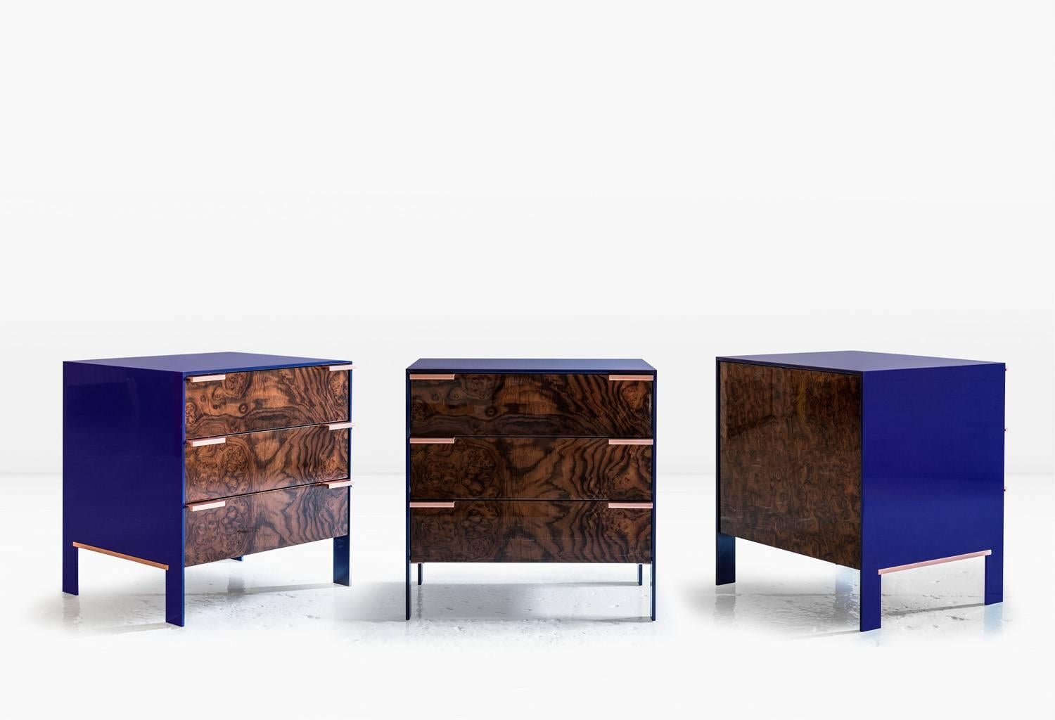 The Johansson cabinet, small has a skin of 1/2 inch lacquered aluminium encasing a cabinet constructed of highly polished wood veneer exteriors and solid wood interiors. Doors have solid metal pulls. Like all KGBL cabinetry, this piece is finished