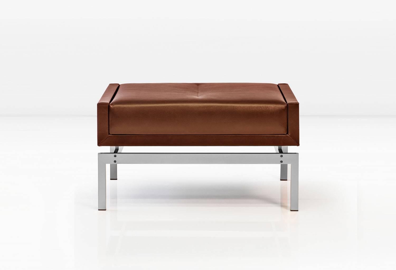 The sheer presence of the Olivera ottoman in any room greatly outweighs its physical size. Shown with nickel base and rosso leather. Available in other metals. 
COM or COL (Customer's own fabric or leather. Fabric / leather not included in the