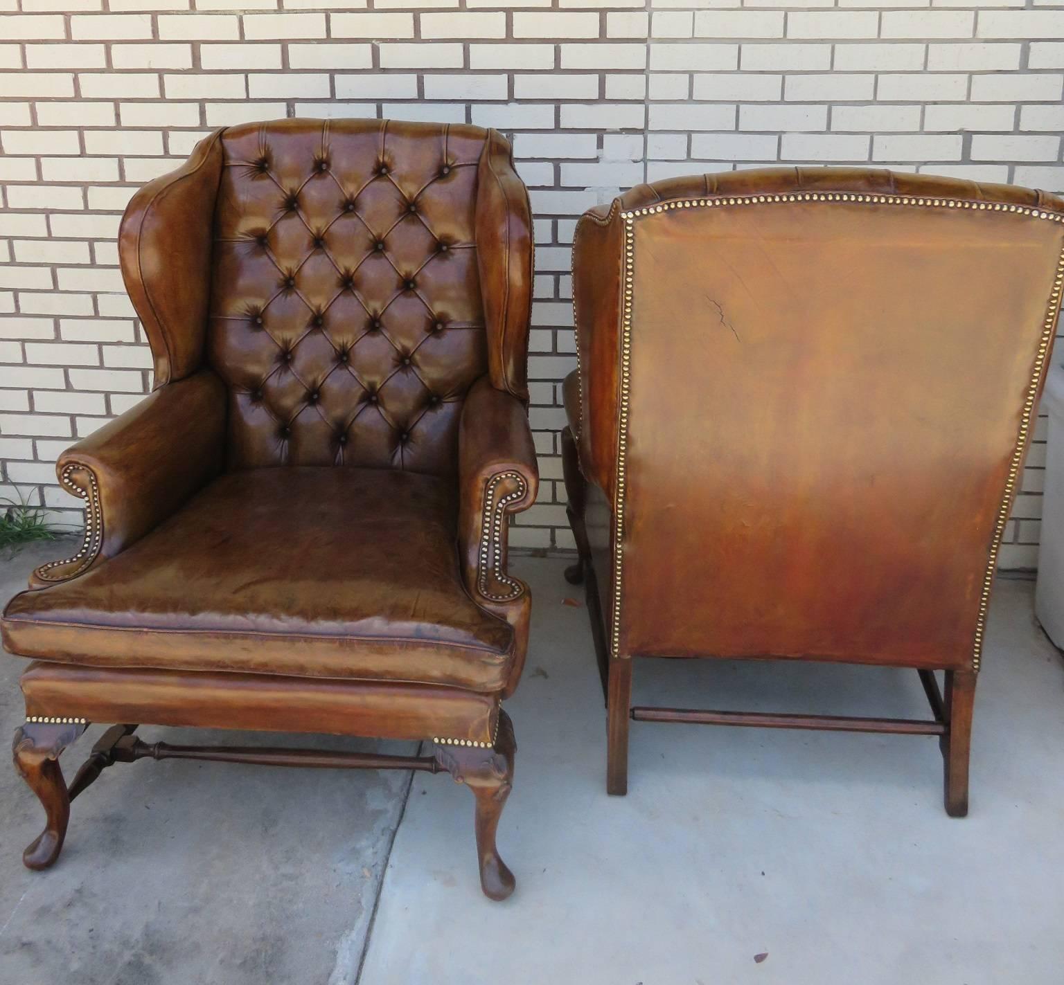 Pair of 1930s English wing chairs in leather.