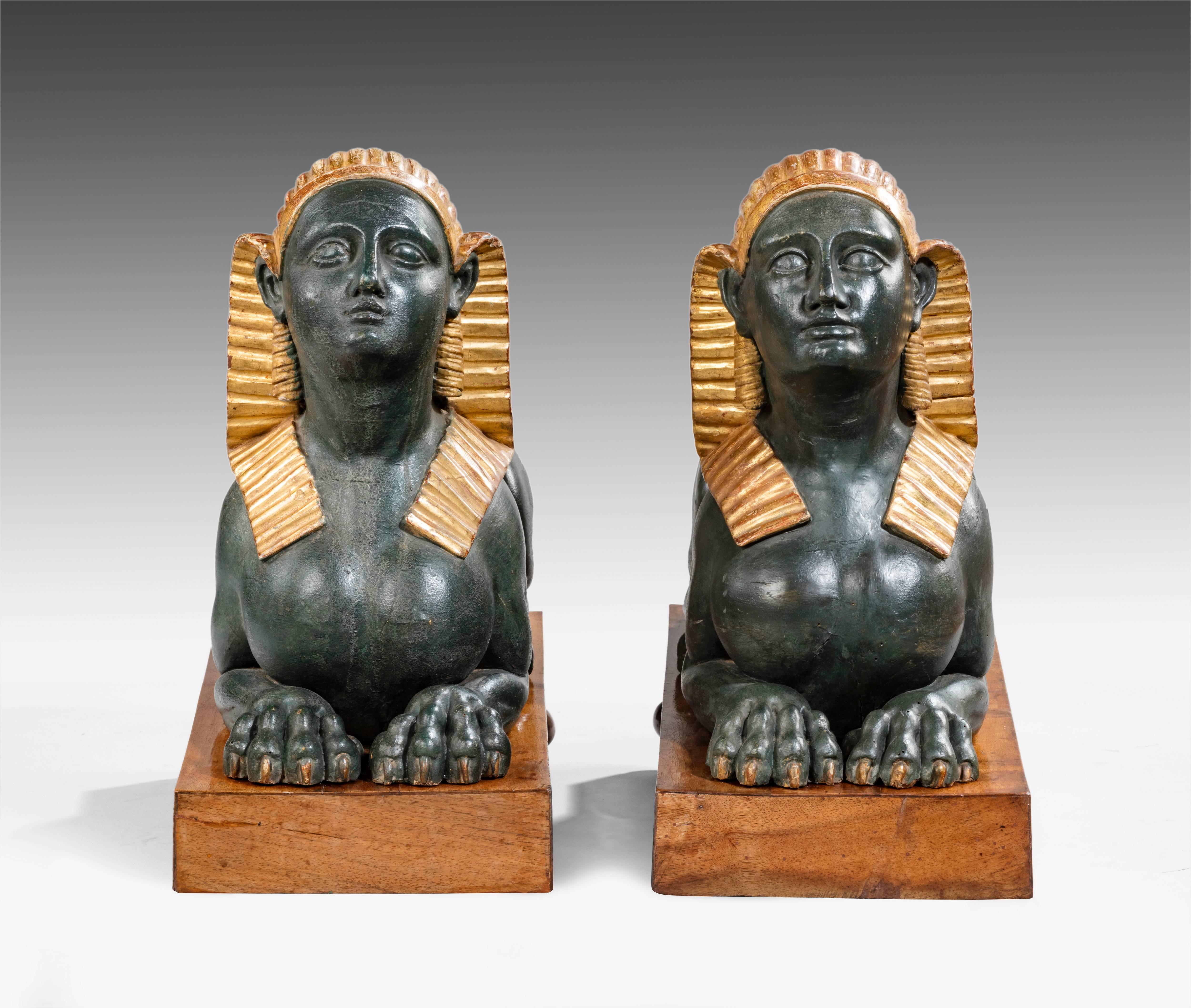 Early 19th Century Pair of Carved Wood, Gesso, Polychrome and Gilt Decorated Egyptomania Sphinxes