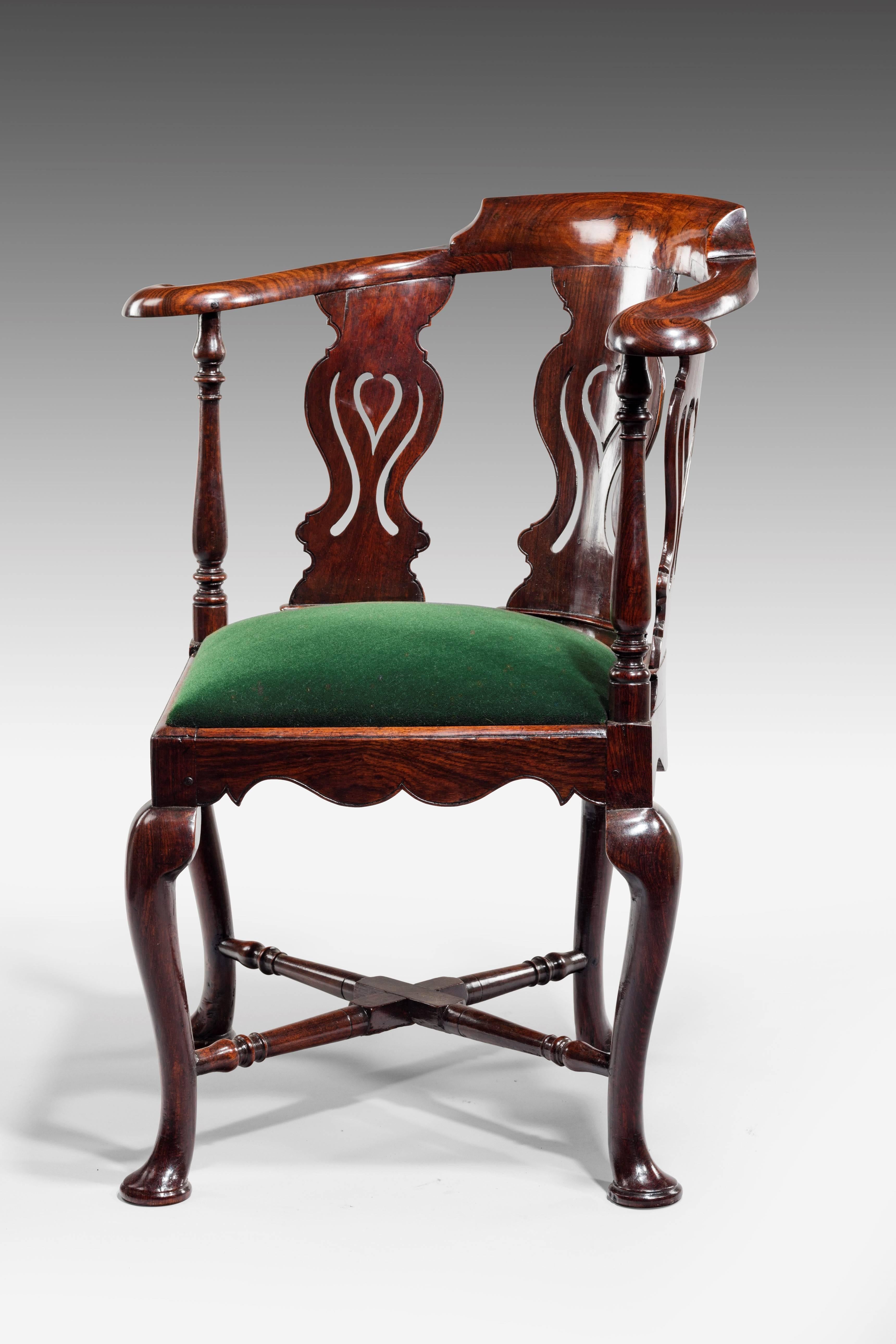 Attributed to a Chinese chair maker working in Goa, India, circa 1765.

With triple pierced splats decorated with pierced ruyi-head, flanked by scrolling arms, scalloped edges to the seat rails and standing on cabriole legs joined by X-frame