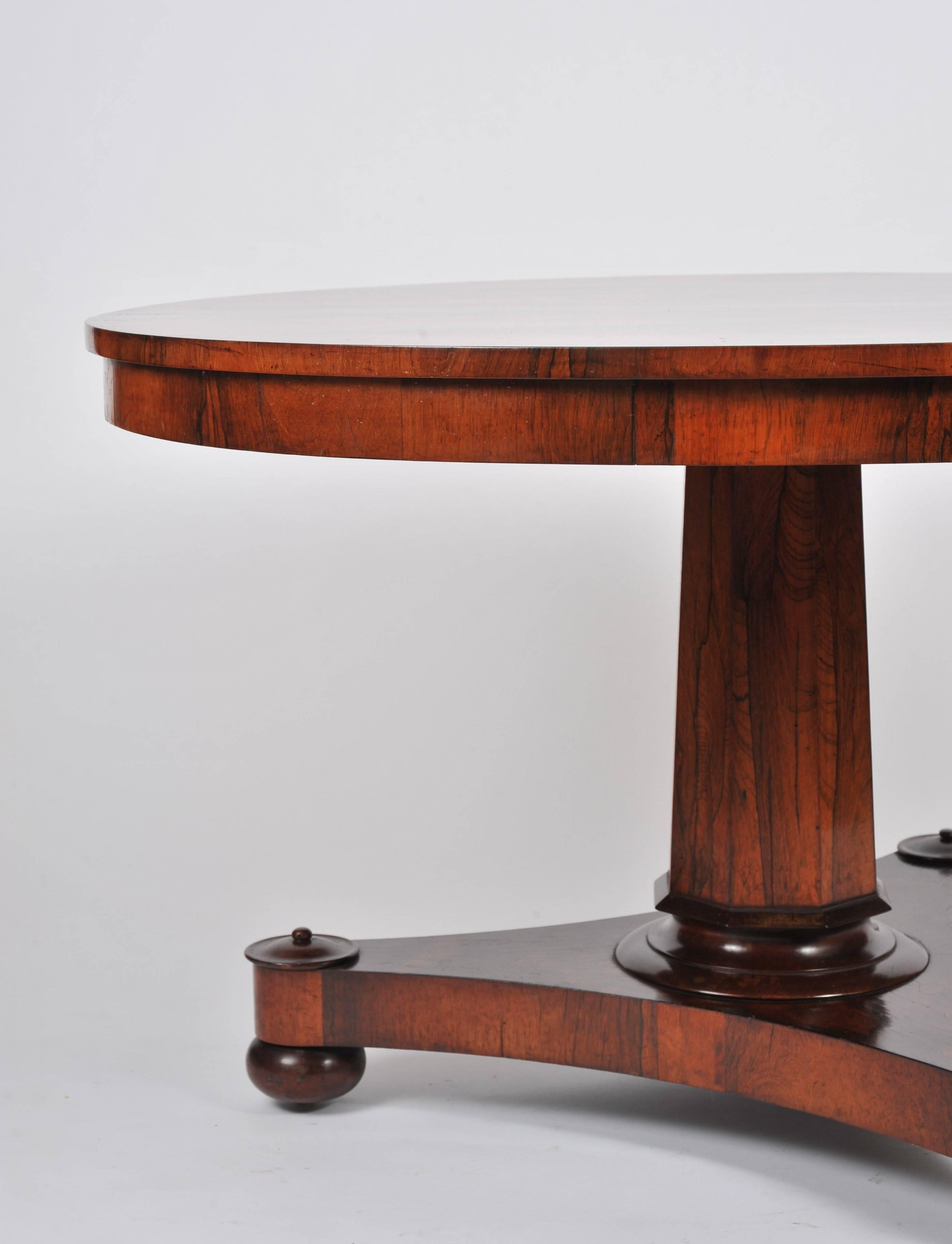 This gorgeous and outstanding quality rosewood circular tilt-top table features a stunning top supported on a central column with a tri form base. The table measures 47 in – 119.5 cm in diameter and 28 ¾ in – 73 cm in height. The table would make an