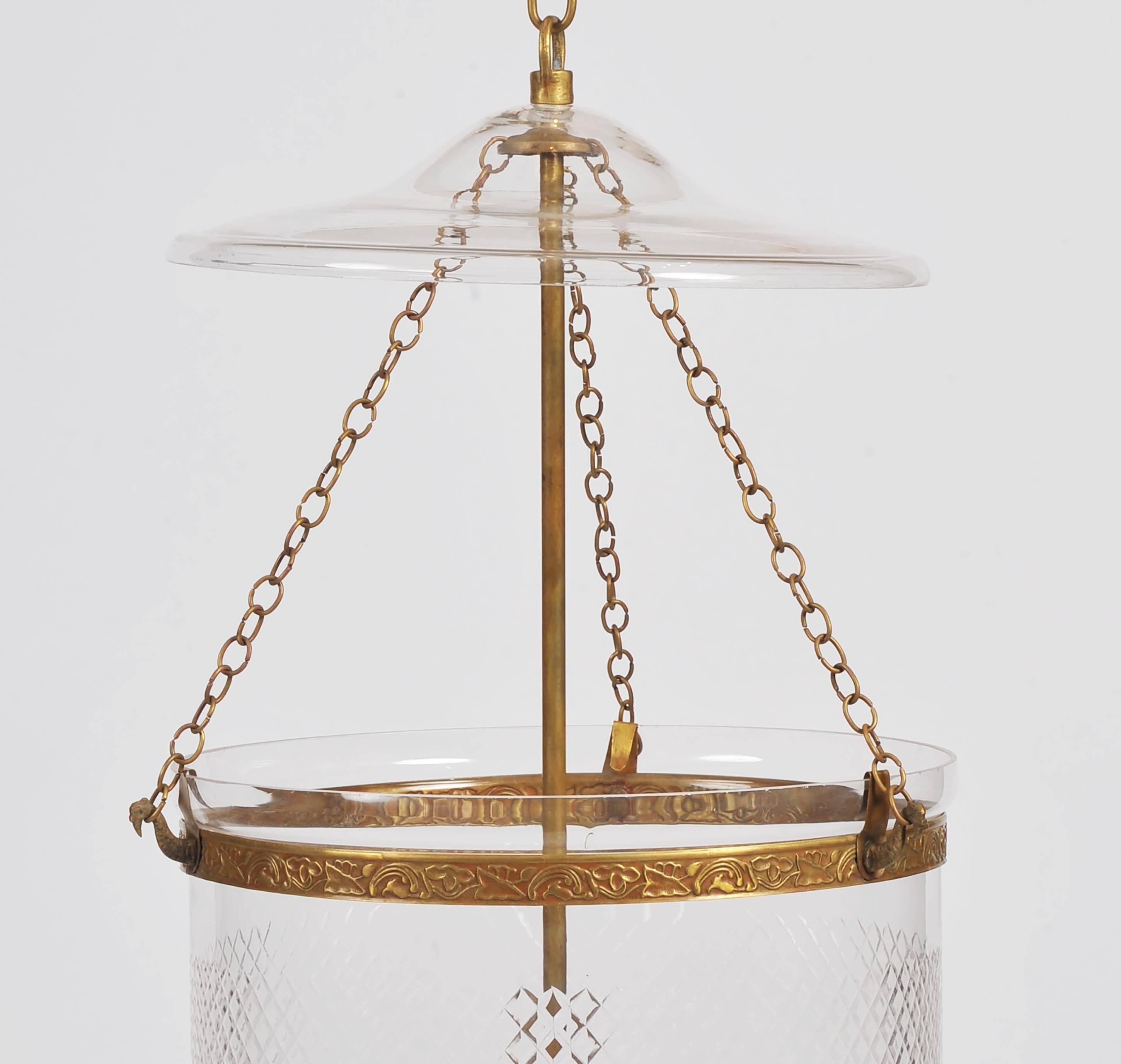 This elegant and well-proportioned handmade glass storm lantern features a hobnail design with polished brass hardware. The lantern has a separate top plate and features an internal four light fitting. The light measures 14 in – 35.5 cm in diameter