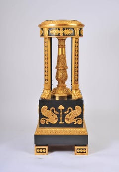 Grand Pair of Ebonized and Gilded Torchieres