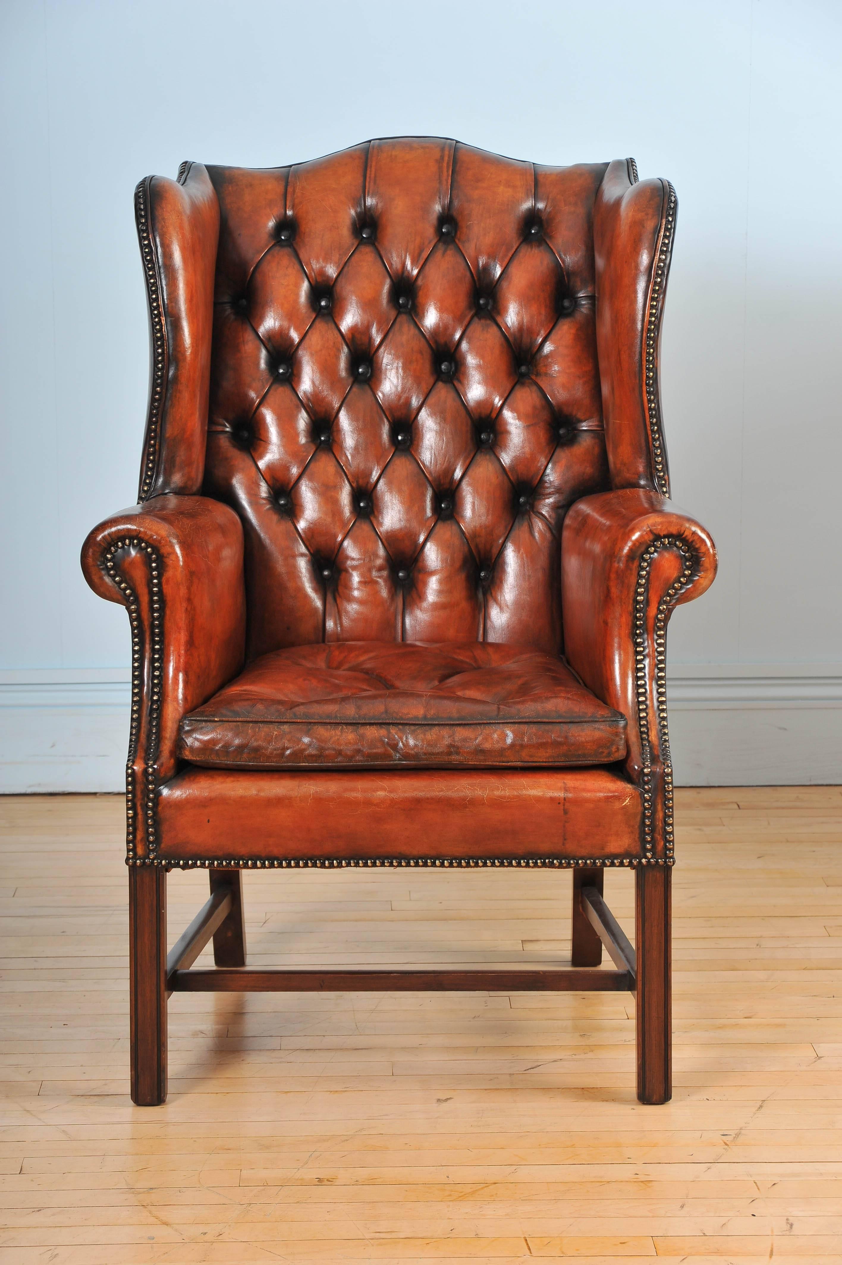 Pair of Mid-20th Century Button Back Leather Wing Chairs In Excellent Condition In London, GB
