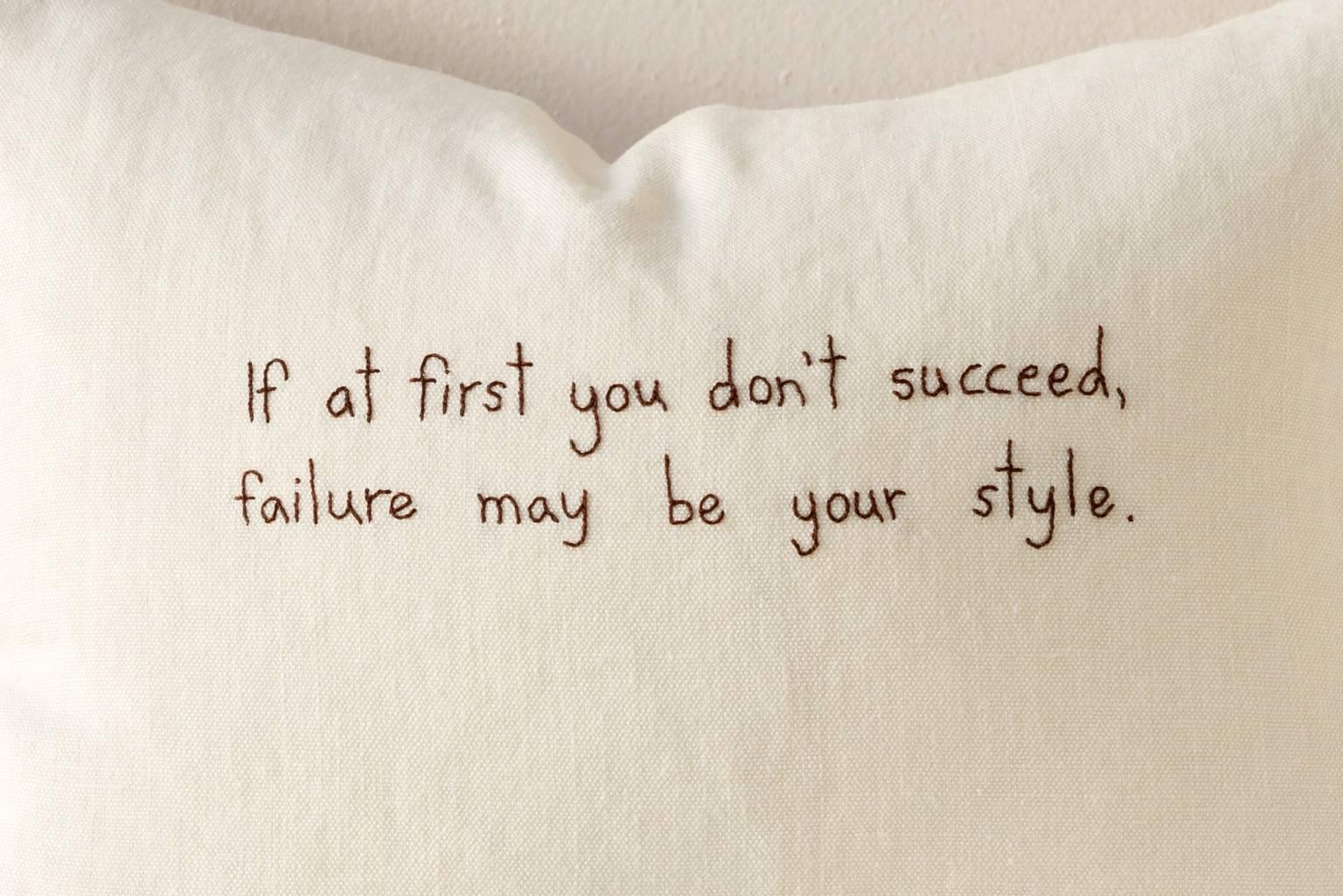 Contemporary cushion in washed soft thick white linen with embroidered text. A Quentin Crisp quote: If at first you don't succeed, failure may be your style.