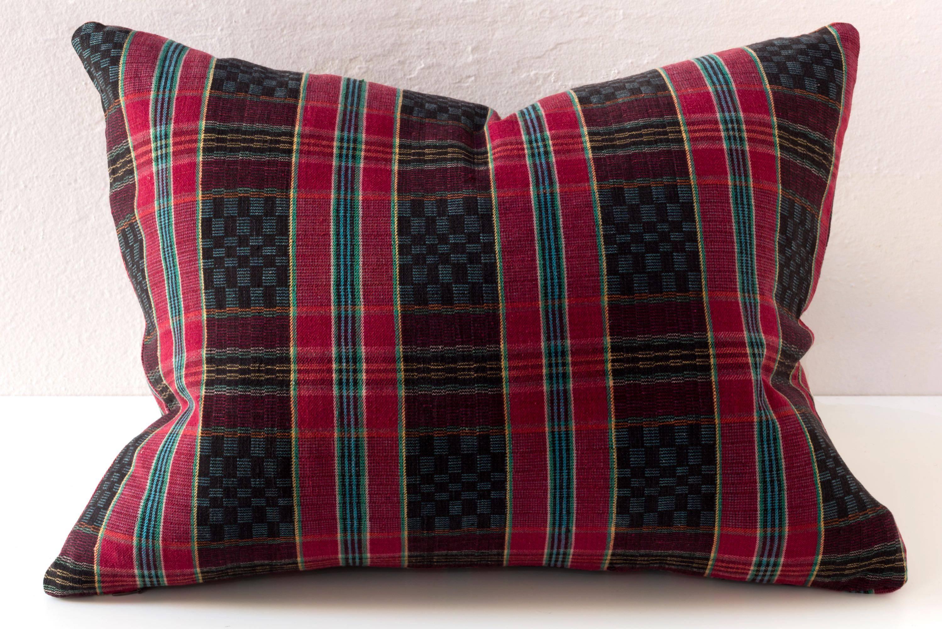 Vintage handwoven cotton in a design not unlike something found in the Bauhaus. Hebei Province, China. An interesting red, black, turquoise, and green. 

This pillow is done with the same fabric on the back as the front. 

feather and down