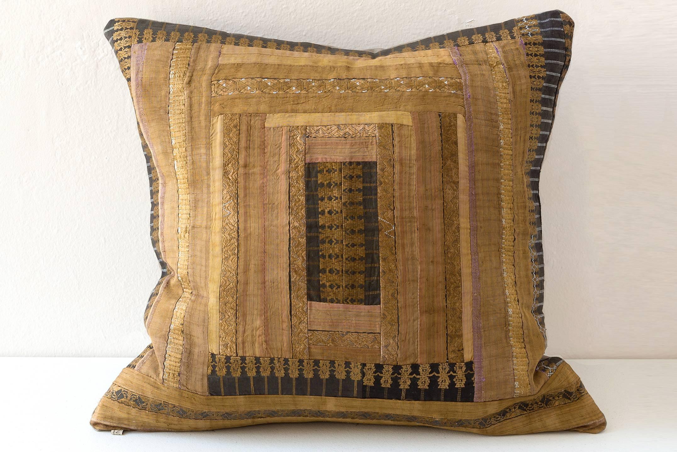 A Huang Ping County Miao, China. Embroidered cushion, silk on cotton; details of Miao skirts and the hand loomed plant dyed cotton from pleated Miao skirts. Various motifs of butterflies (symbolic of the butterfly mother who created the earth and