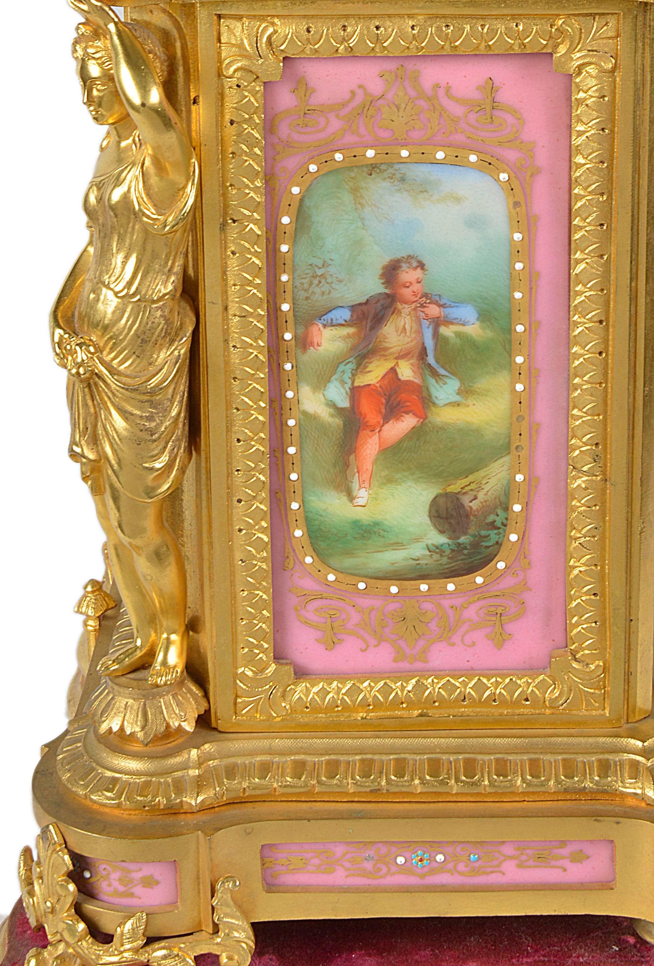 A very good quality French 19th century gilded ormolu and pink Sevres porcelain mantel clock. Having monopodia supports, a putti supporting an urn, classical romantic scenes painted to the clock face. An eight day movement striking on the hour and