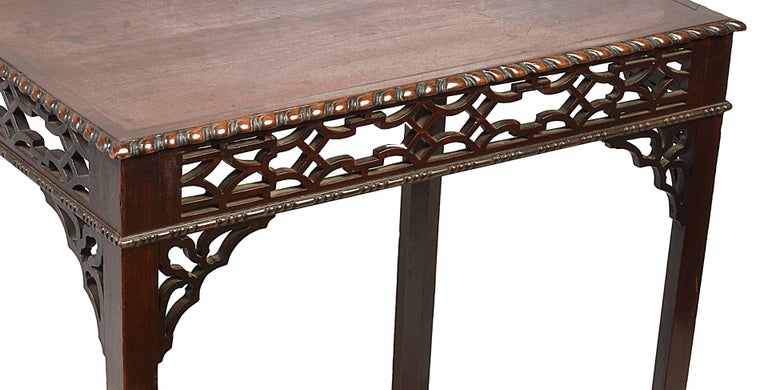 A good quality early 19th century mahogany side table, having a gadrooned moulding to the top, fret work frieze around with brackets, and raised on square canted legs.