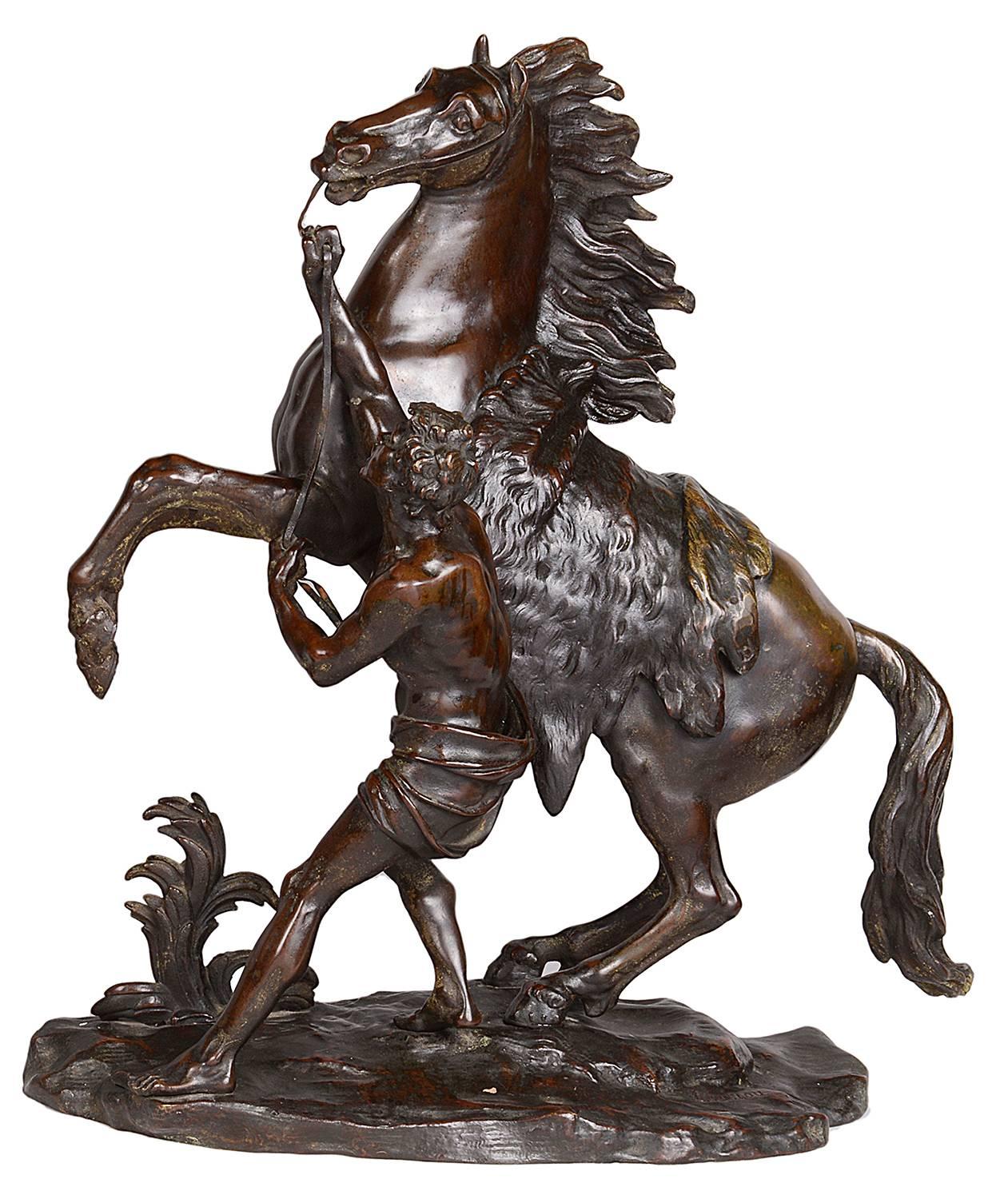 A very impressive pair of 19th century bronze Marly horse, having a good patina, after Guillaume Coustou the elder 1677-1746.

