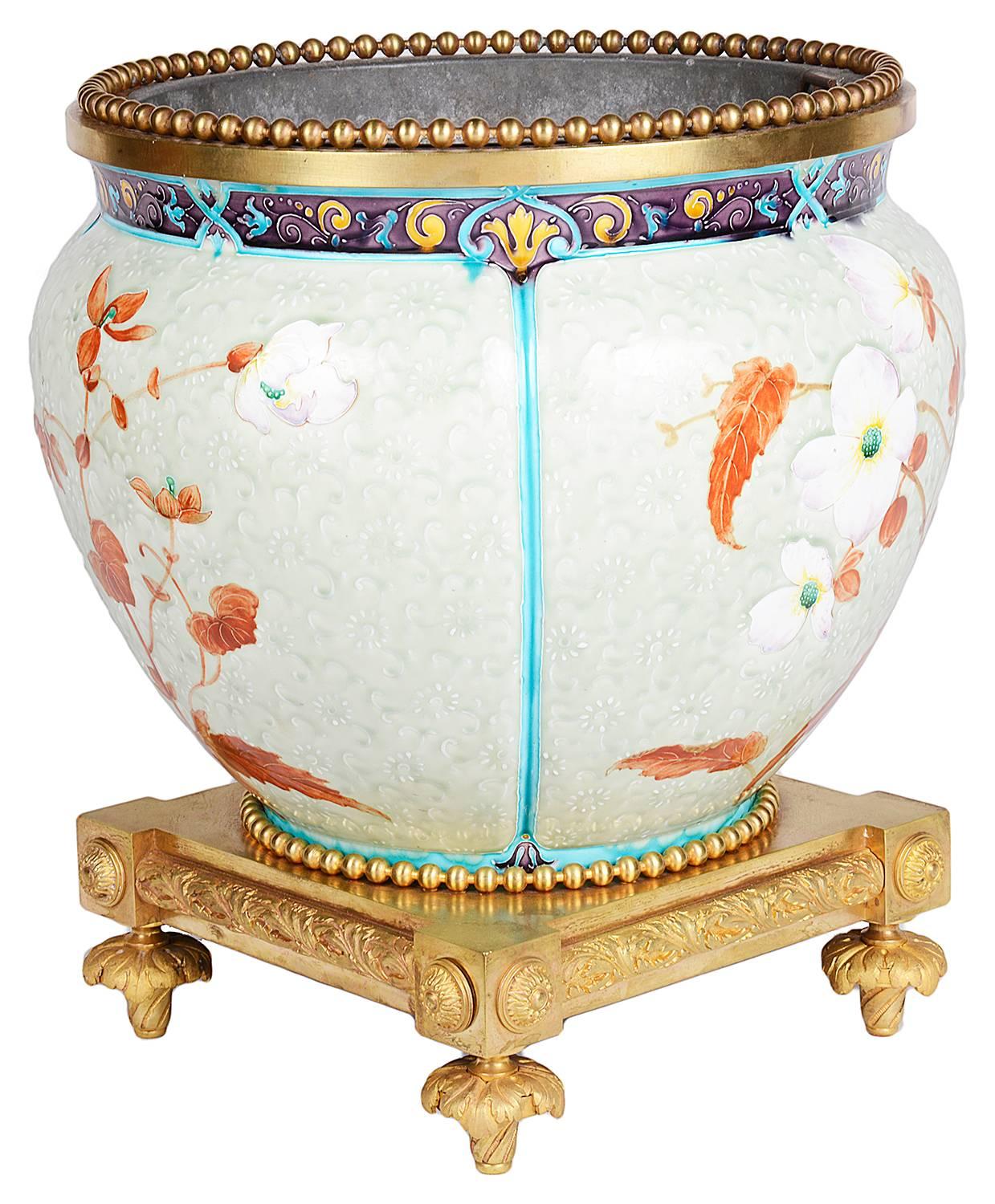 A fine quality French mid-19th Century enamel porcelain, ormolu-mounted jardinière, having Japanese style flowers and motifs. In the style of Theodore Deck (1823-1891)