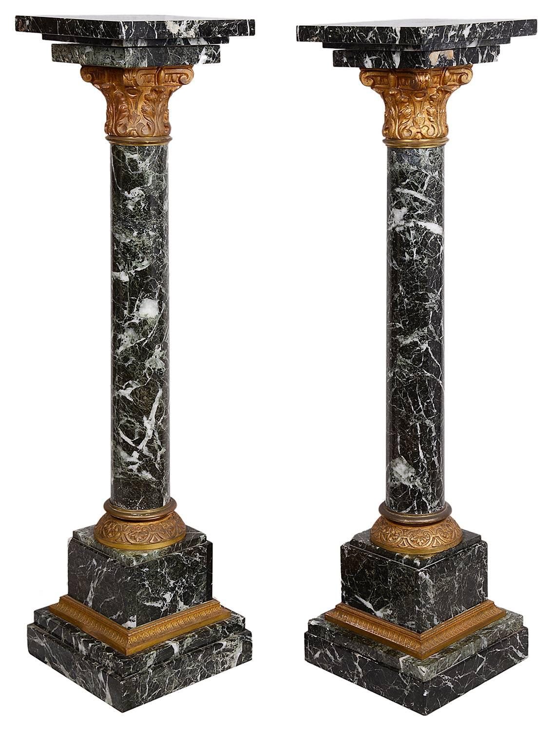 A good quality unusually small pair of Louis XVI style marble and ormolu pedestals 84cm high.
