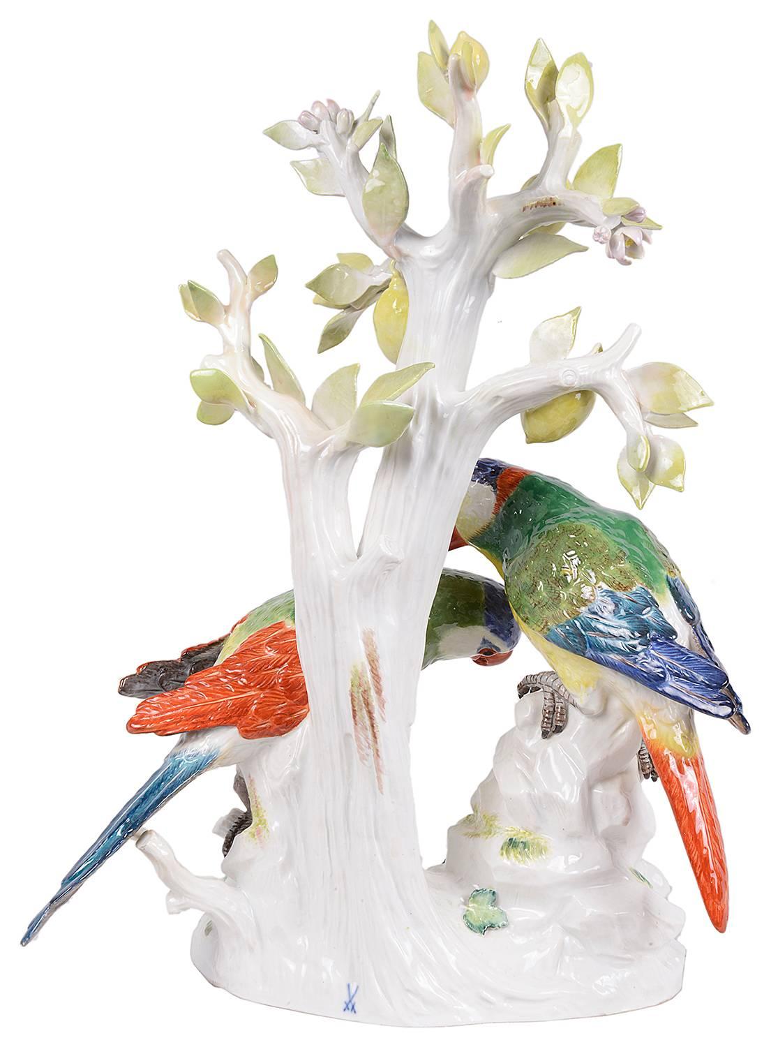 A good quality pair of Meissen Porcelain Parrots perched on a rock by a Lemon tree. Blue crossed swords mark.
