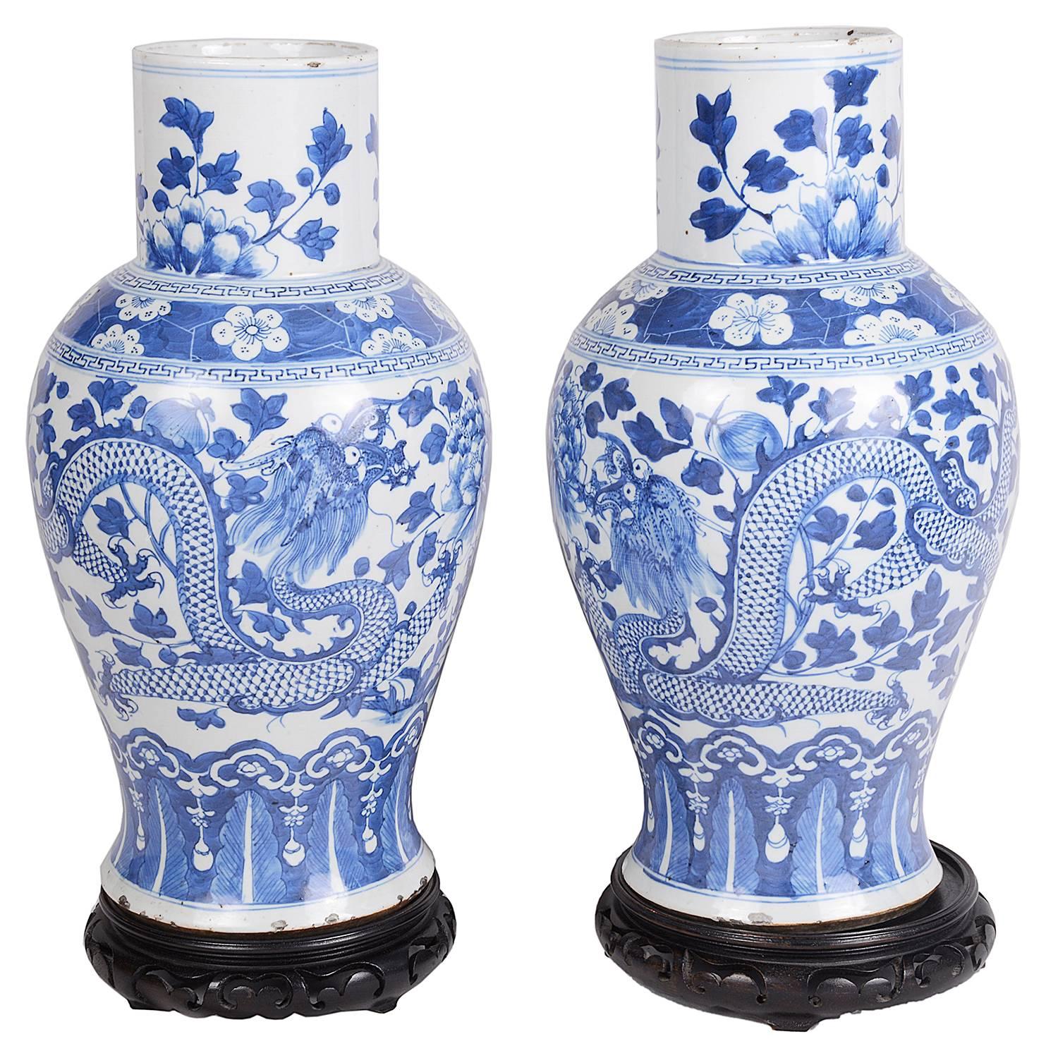 A good quality pair of Chinese 19th Century Blue and White vases. Each depicting mythical dragons amongst leaves and flowers.
We can arrange to have these converted to lamps, if you wish.