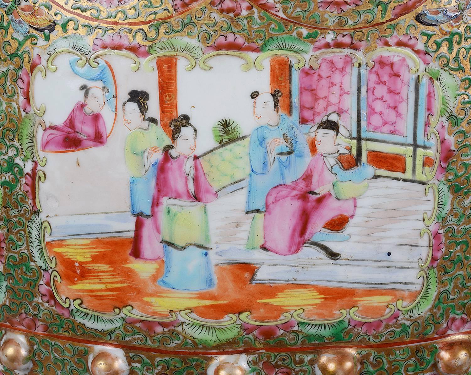 A good quality Chinese 19th Century Cantonese porcelain medallion Garden seat. Having classical Chinese garden and interior scenes set in a Green ground with flowers, leaves and gilded decoration, also with pierced decoration to the top and sides.