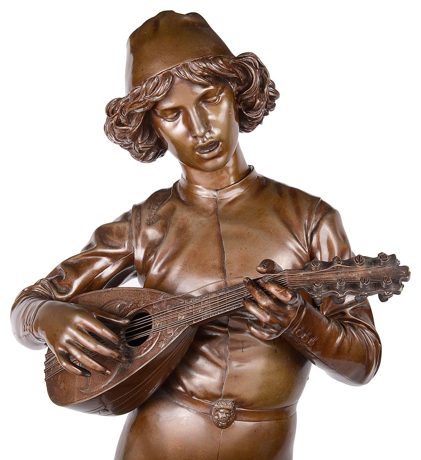 A very good quality 19th Century Bronze statue of a minstrel player, signed Barbedienne.