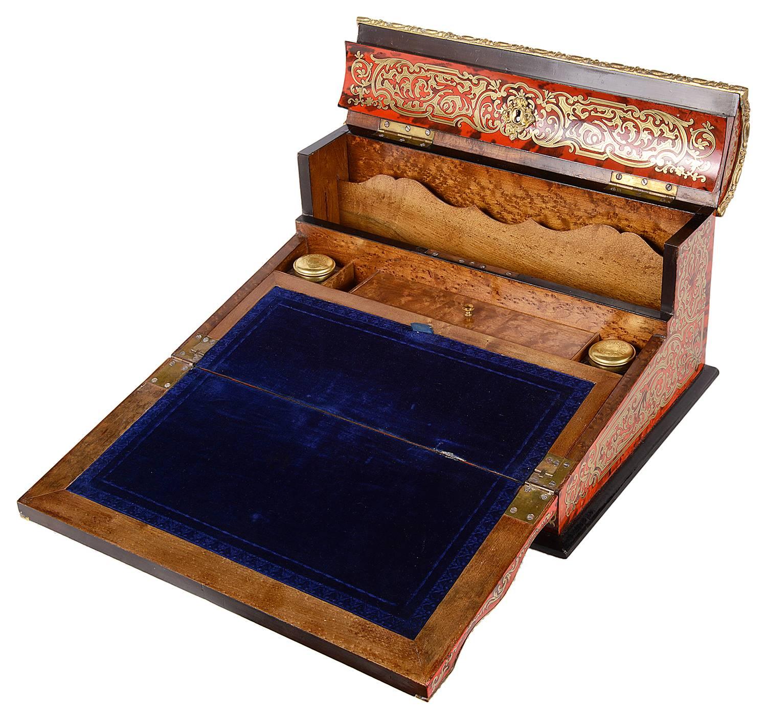 A good quality 19th French boulle inlaid stationary box. Having brass inlay, a hinged top revealing compartments, a further hinged writing tablet with an inset velvet slope.