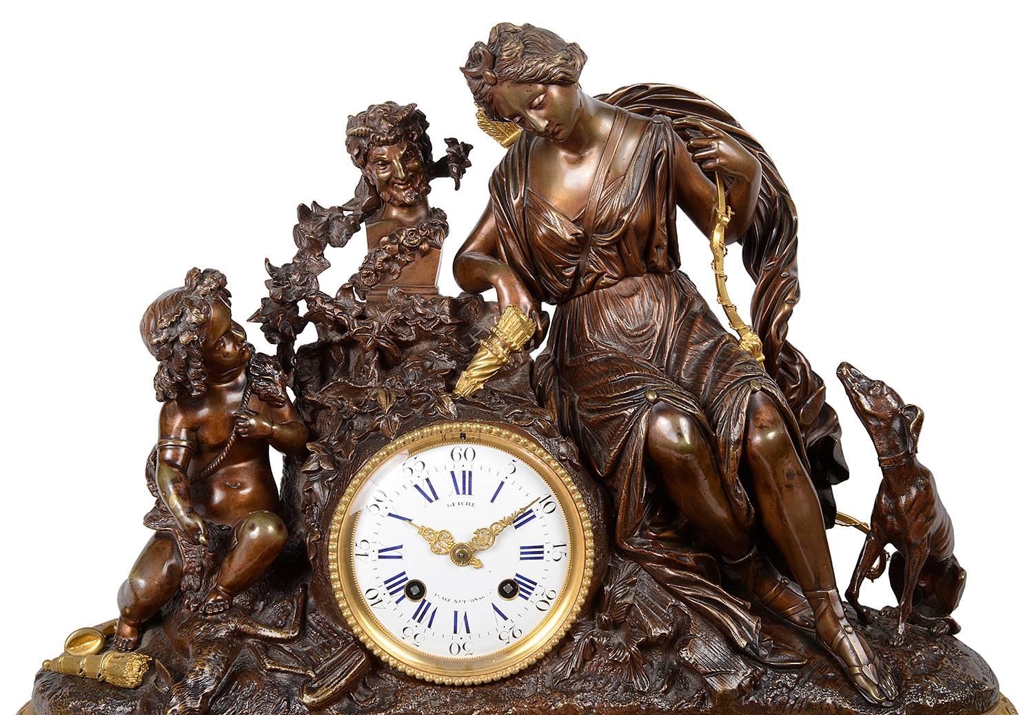A large and impressive, good quality 19th century French Louis XVI style gilded ormolu and bronze clock set. Having a mother and child mounted above the clock, which has an eight day, hour and half hour striking movement, signed; Guiche, Palais