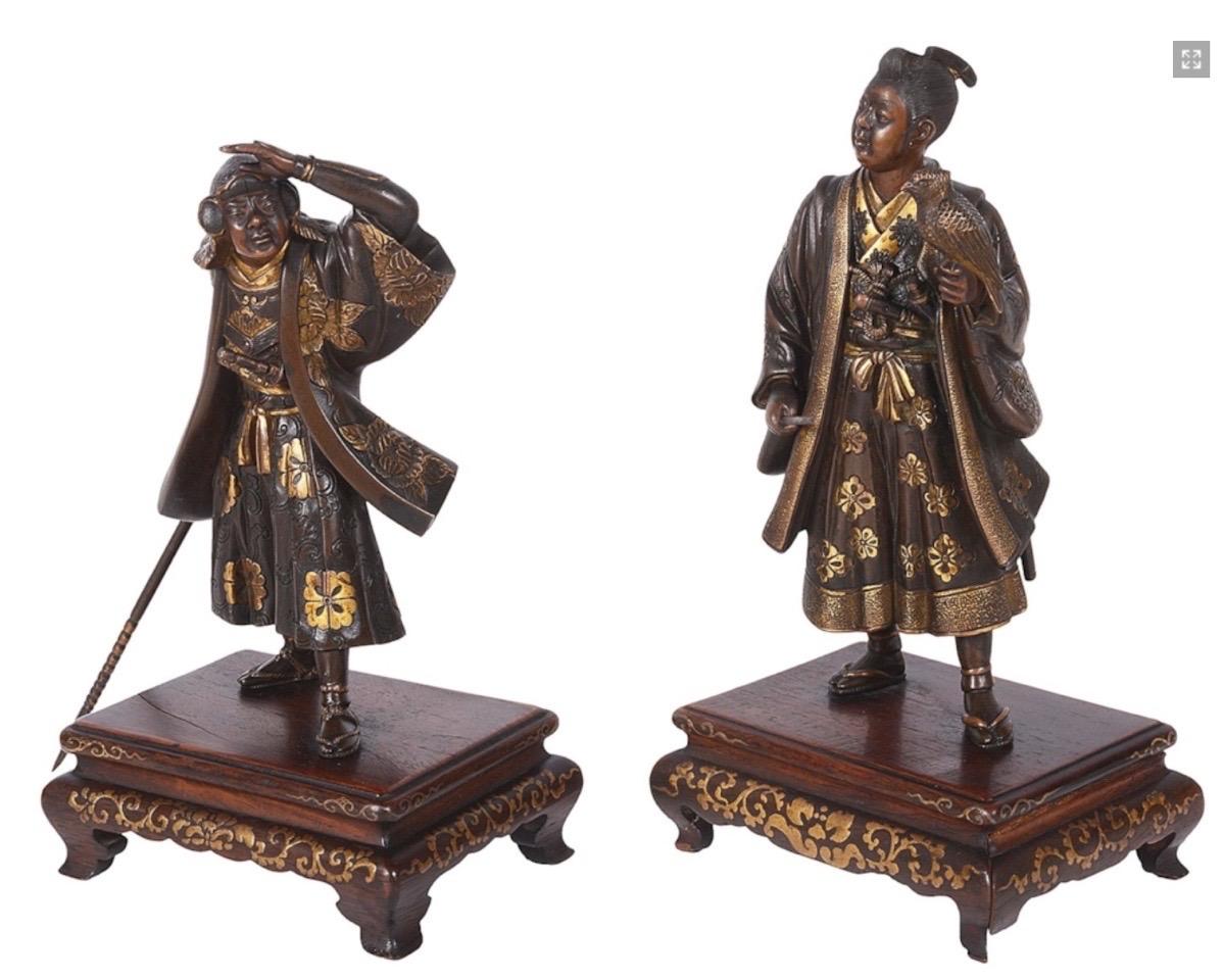 A fine quality pair of 19th century Japanese Miyao bronze statues of a Falconer and Sumo warrior in patinated bronze with gold leaf highlights. Mounted on carved hardwood stands also with gilded decoration.
Signed.