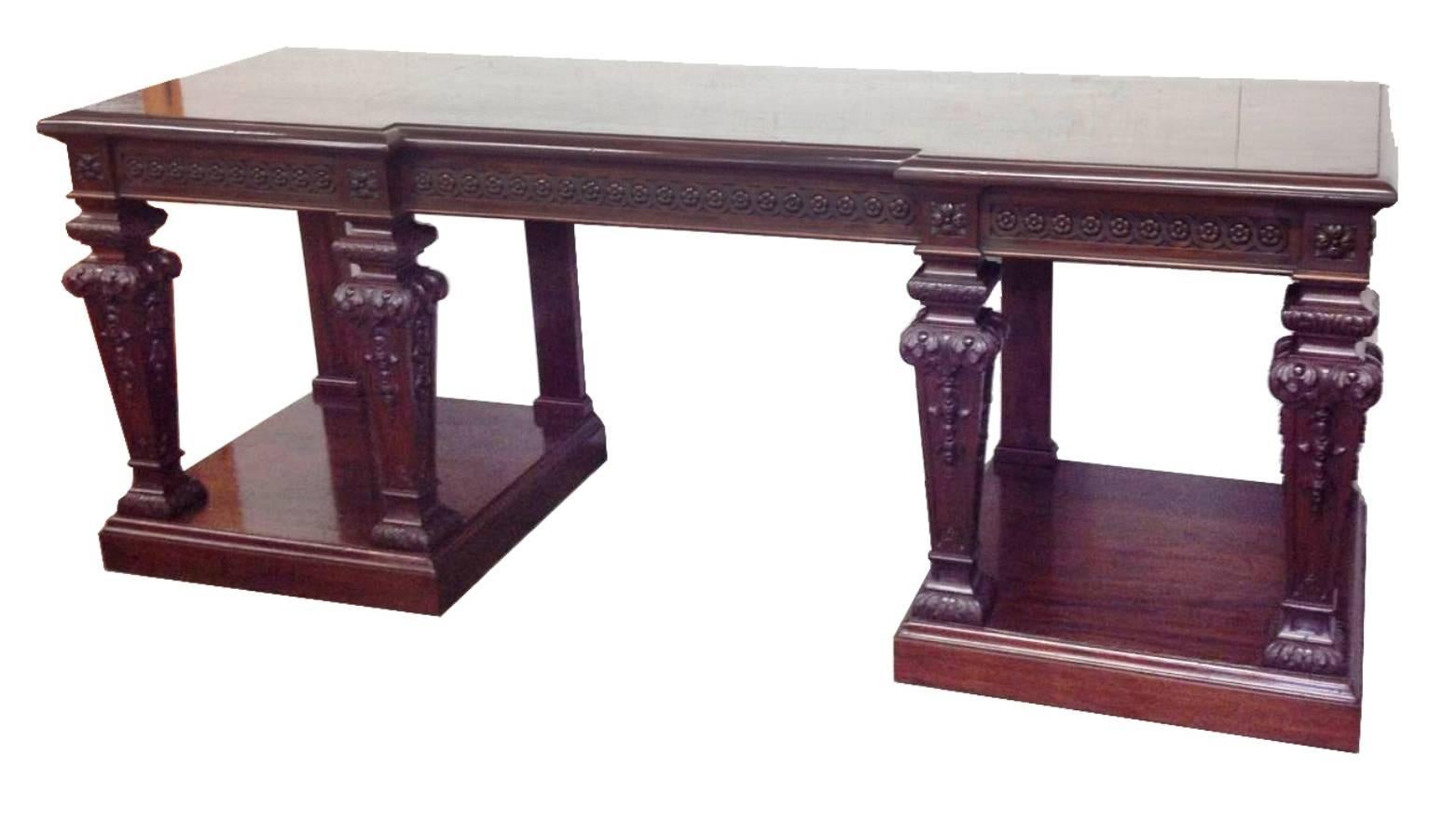 A very impressive classical 19th century mahogany console table, stamped 'Holland and Son'. Having carved paterae to the frieze, square tapering legs set on plinth bases. 
Provenience: 'The Grand Hotel' Brighton.
(A pair to this table is available.)