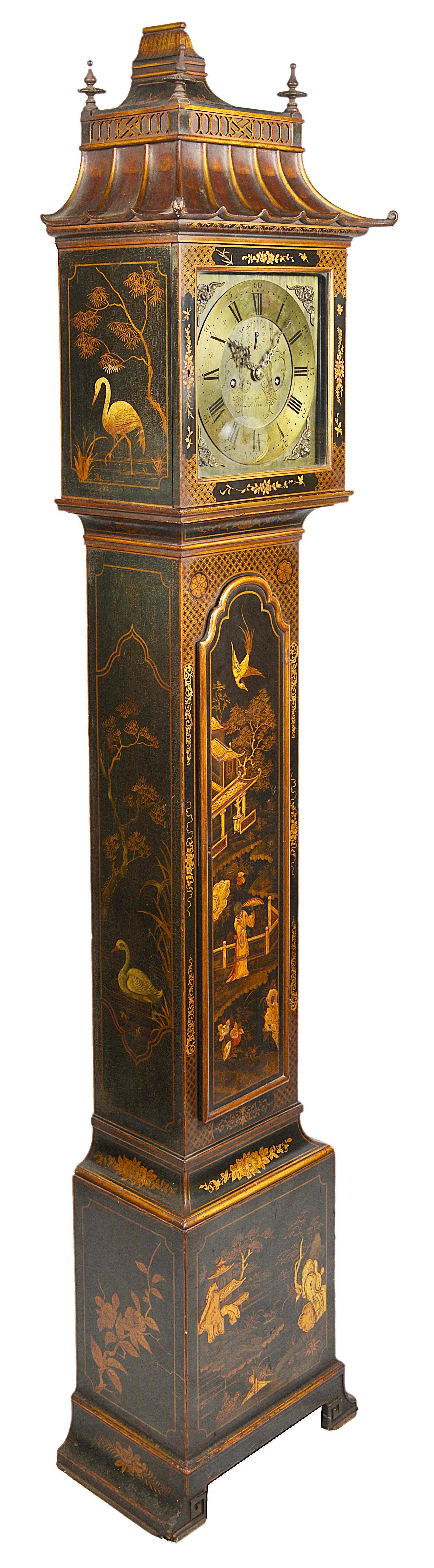 A good quality Chinese Chippendale style chinoiserie lacquer grandmother clock. Having a pagoda style hood, brass faced, eight-day movement. The case having gilded classical oriental scenes.
Retailers; Maples, London.